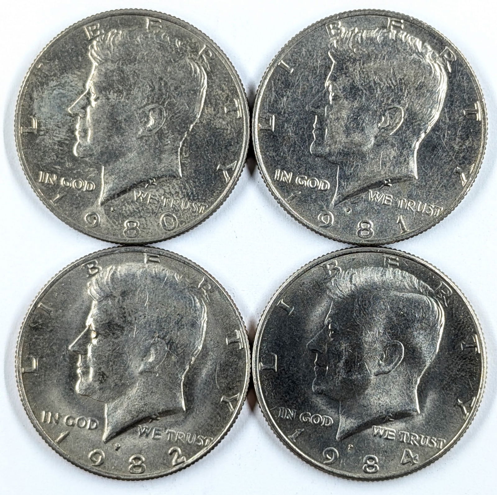 Lot of 4 Uncirculated John F Kennedy Half Dollars- 1980-1984 (1 of 2)