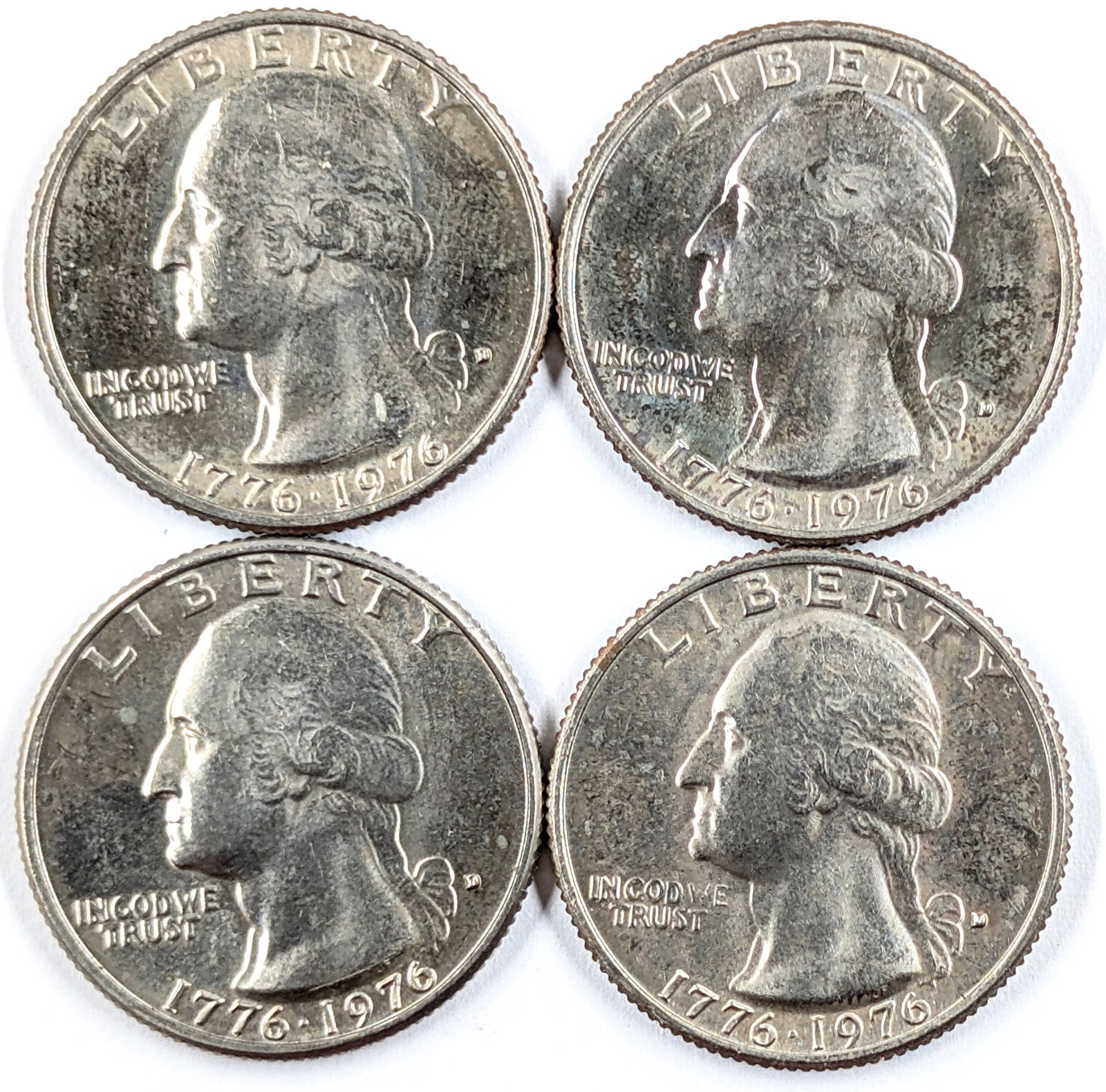Lot of 4 1976 Bicentennial Commemorative Quarters: _ 