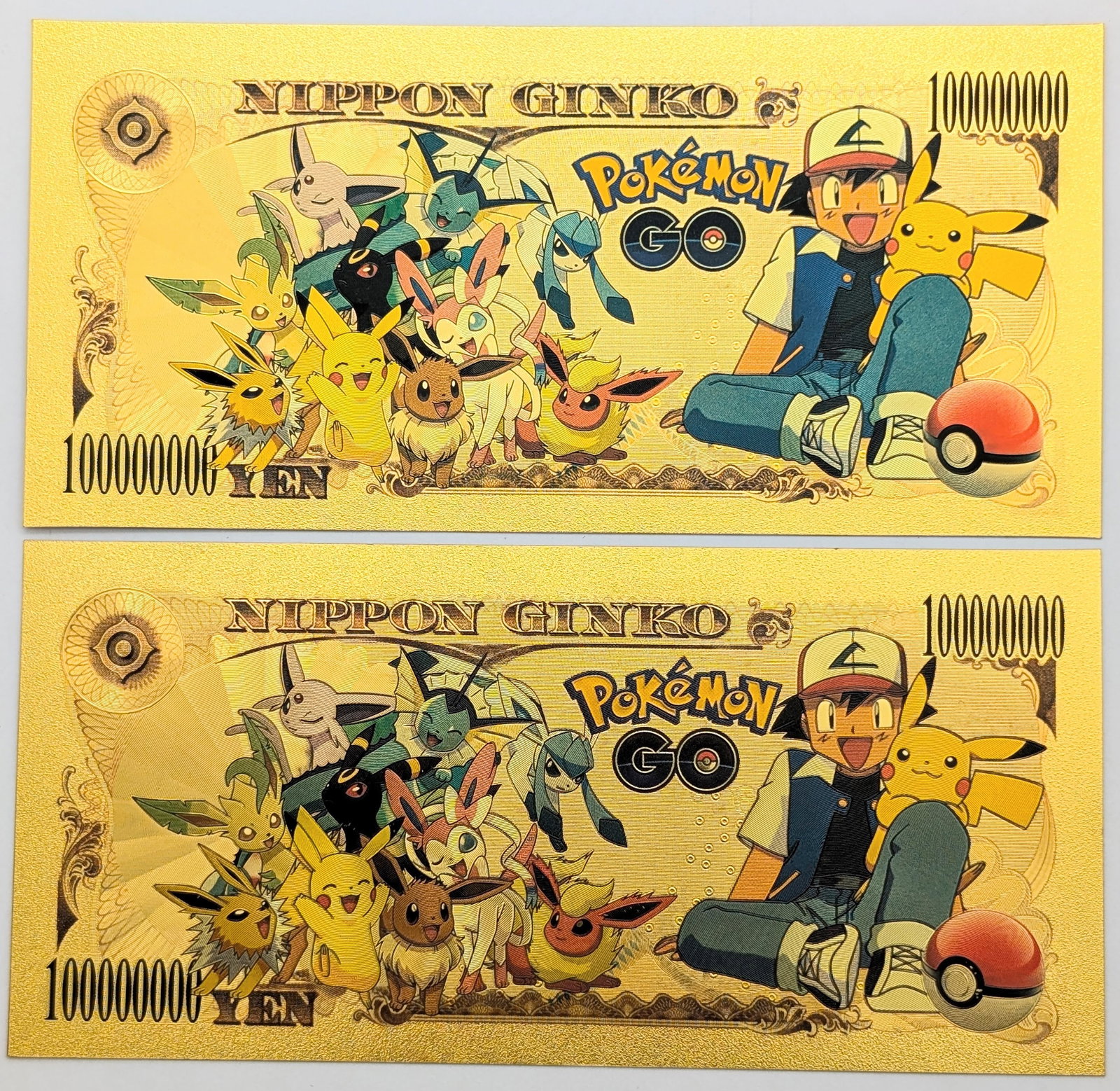 Lot of 2 Pokemon Gold foil $100,000,000 design - 2