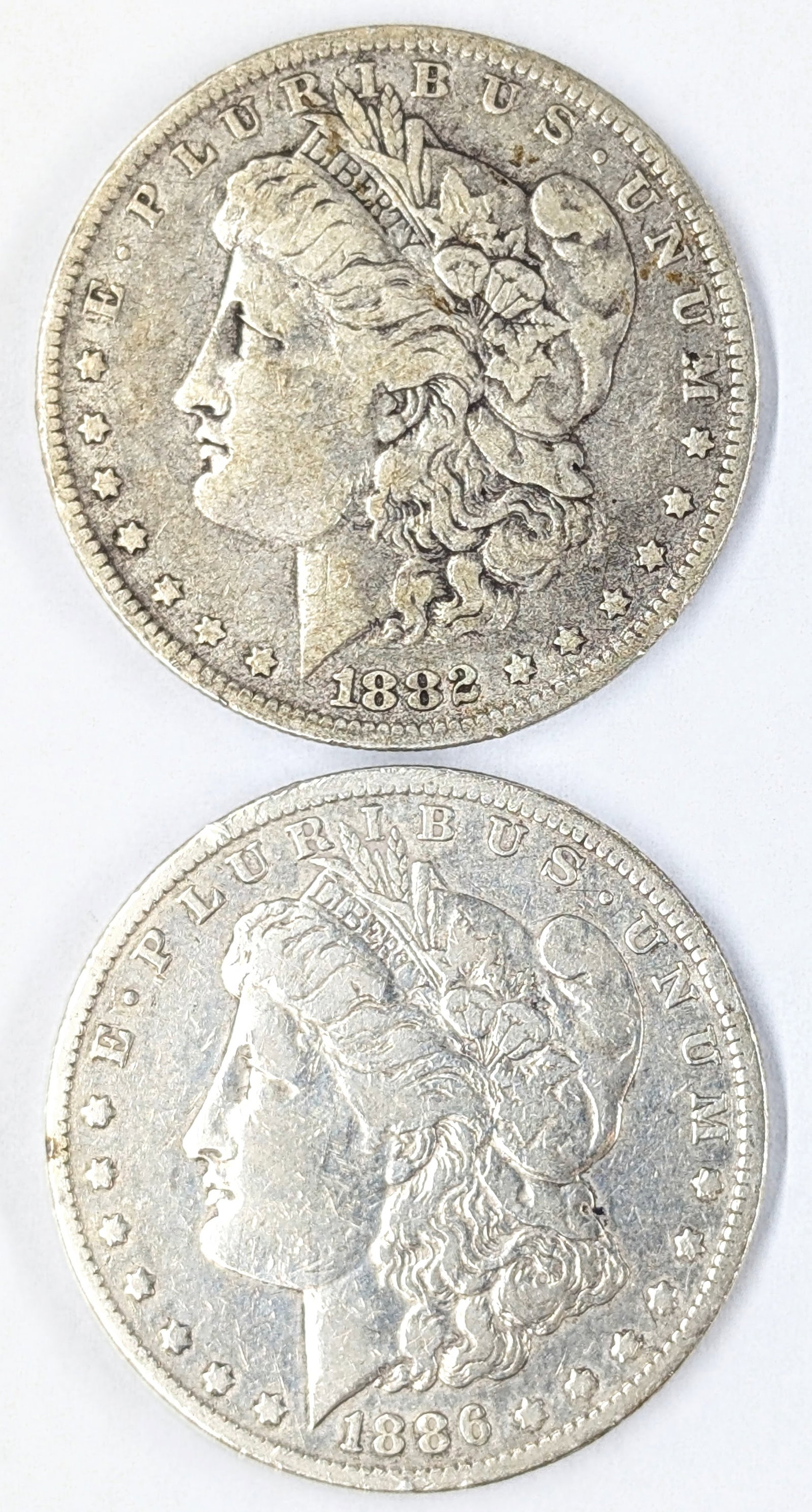 Lot of 2 Morgan Silver Dollars- 1882-O, 1886-O: _