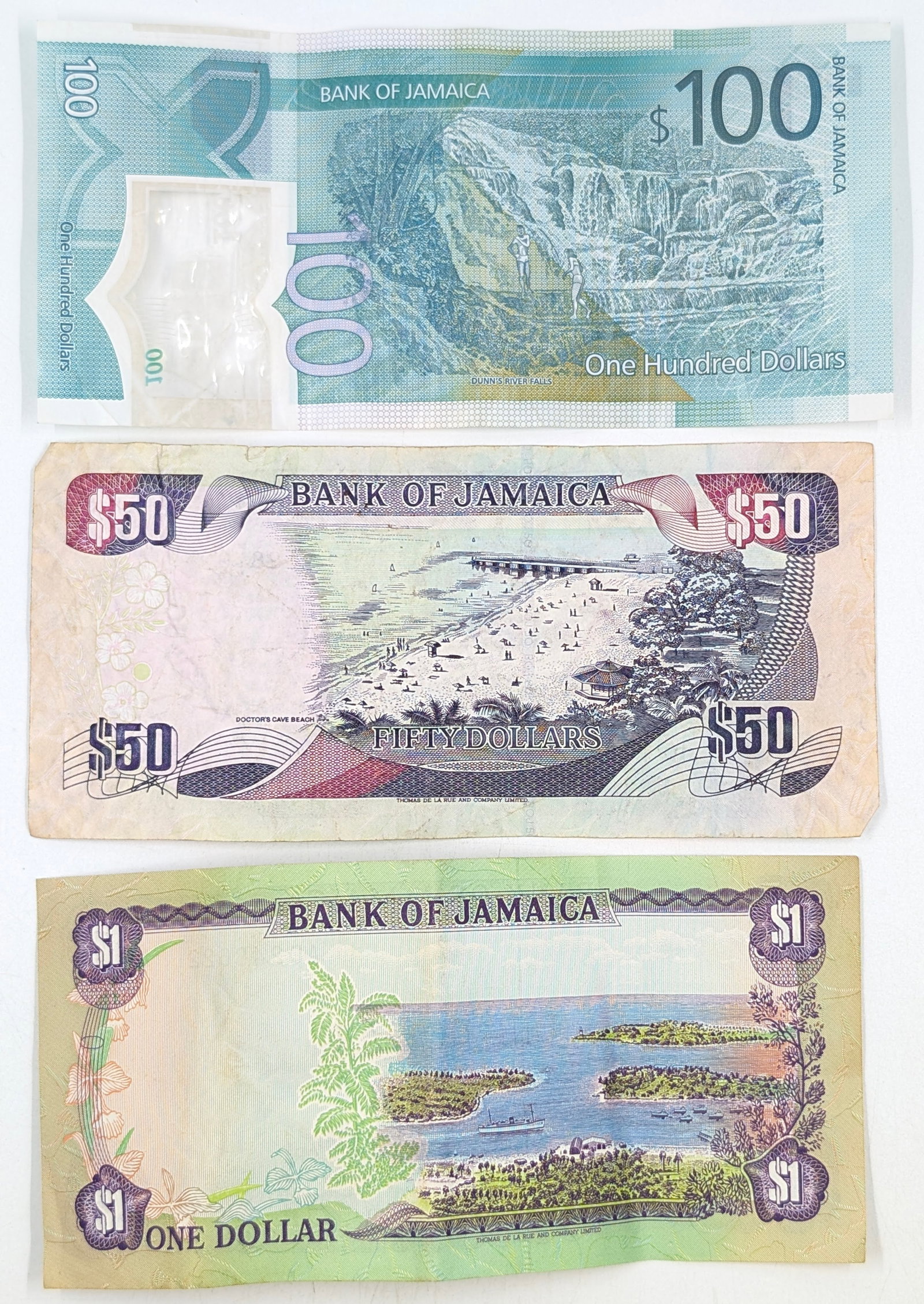 Lot of 3 Jamaican Banknotes- $100, $50, $1 - 2