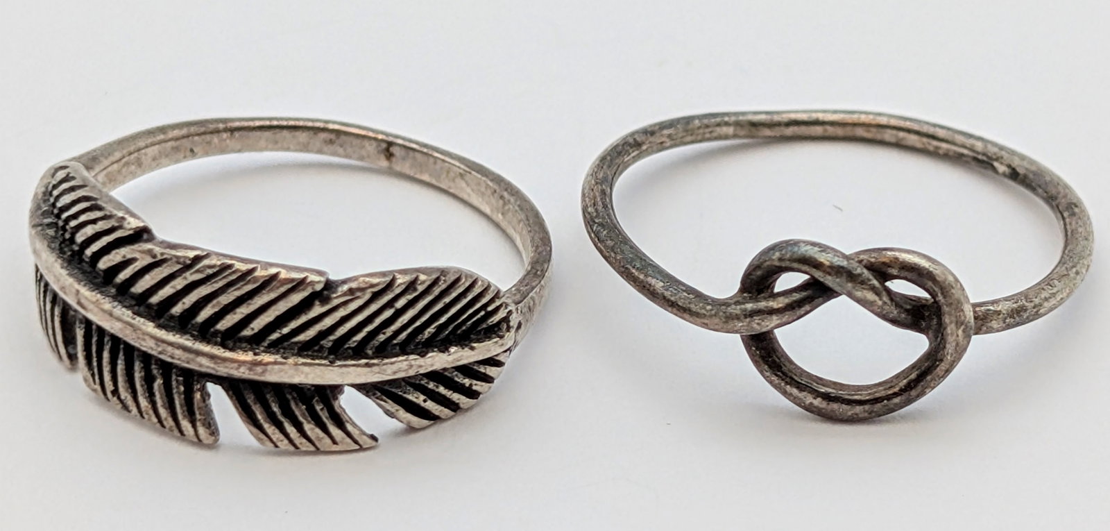 Lot of 2 Sterling Silver Rings- Feather, Knot: Size: 6.5, 6.75