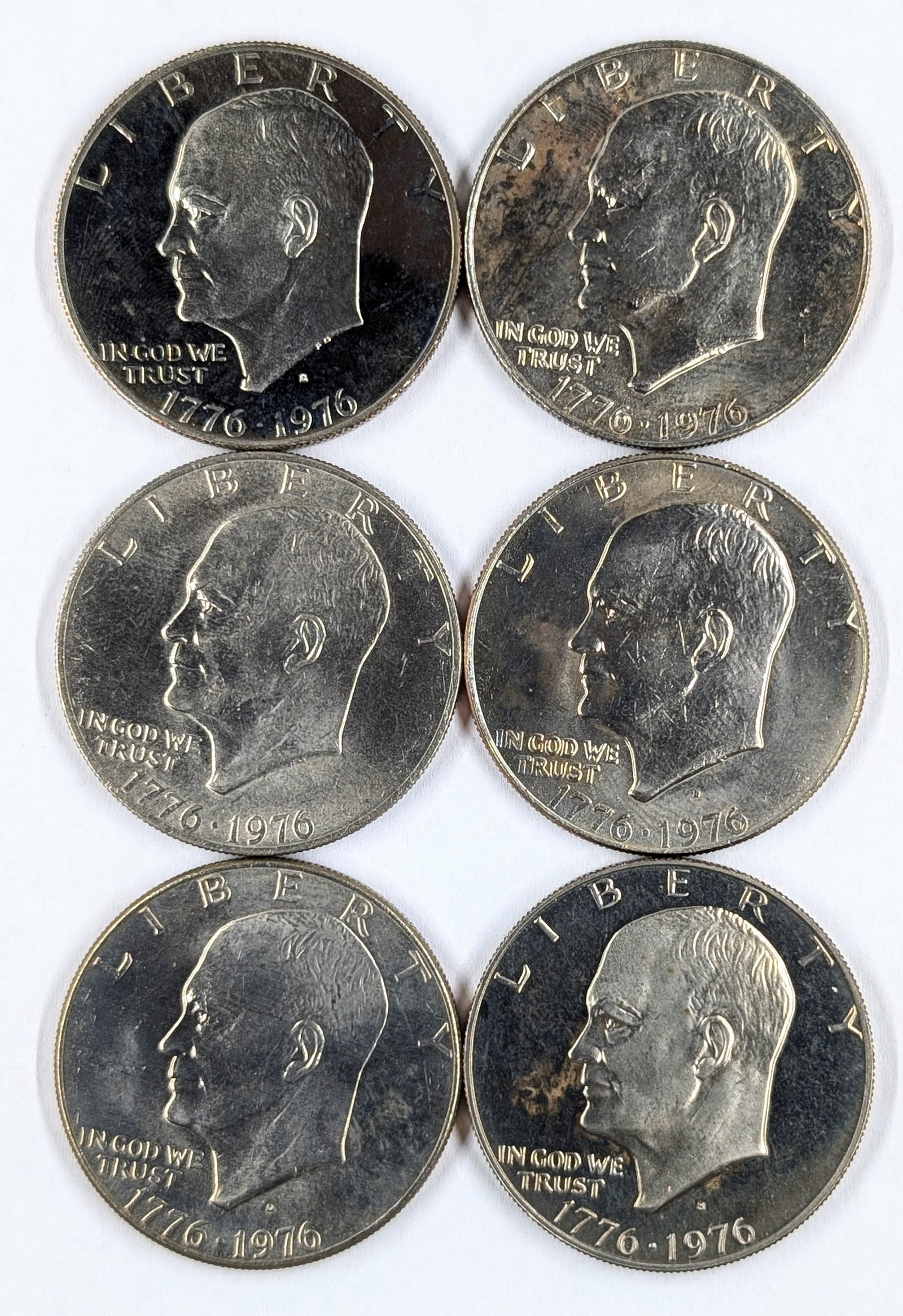 Lot of 6 1976 Ike Dollars - All proof or Uncirculated!: All 6 Varieties of the clad Ike dollar are included. 1976 (TI) 1976 (TII) 1976D (TI) 1976 D (TII) 1976S (TI) 1976S (TII)