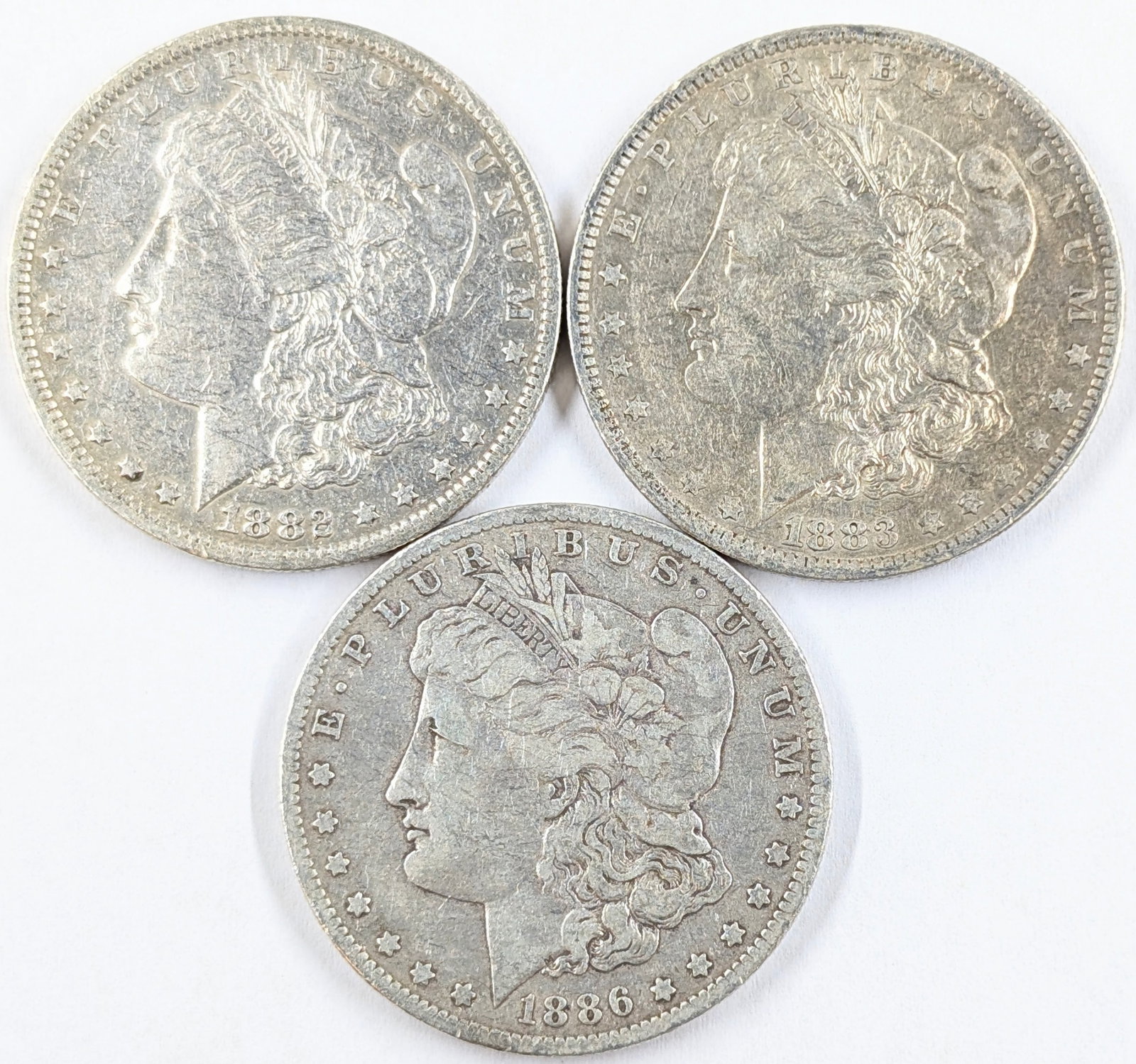 Lot of 3 Morgan Silver Dollars 1882 O, 1883O and 1886O: _
