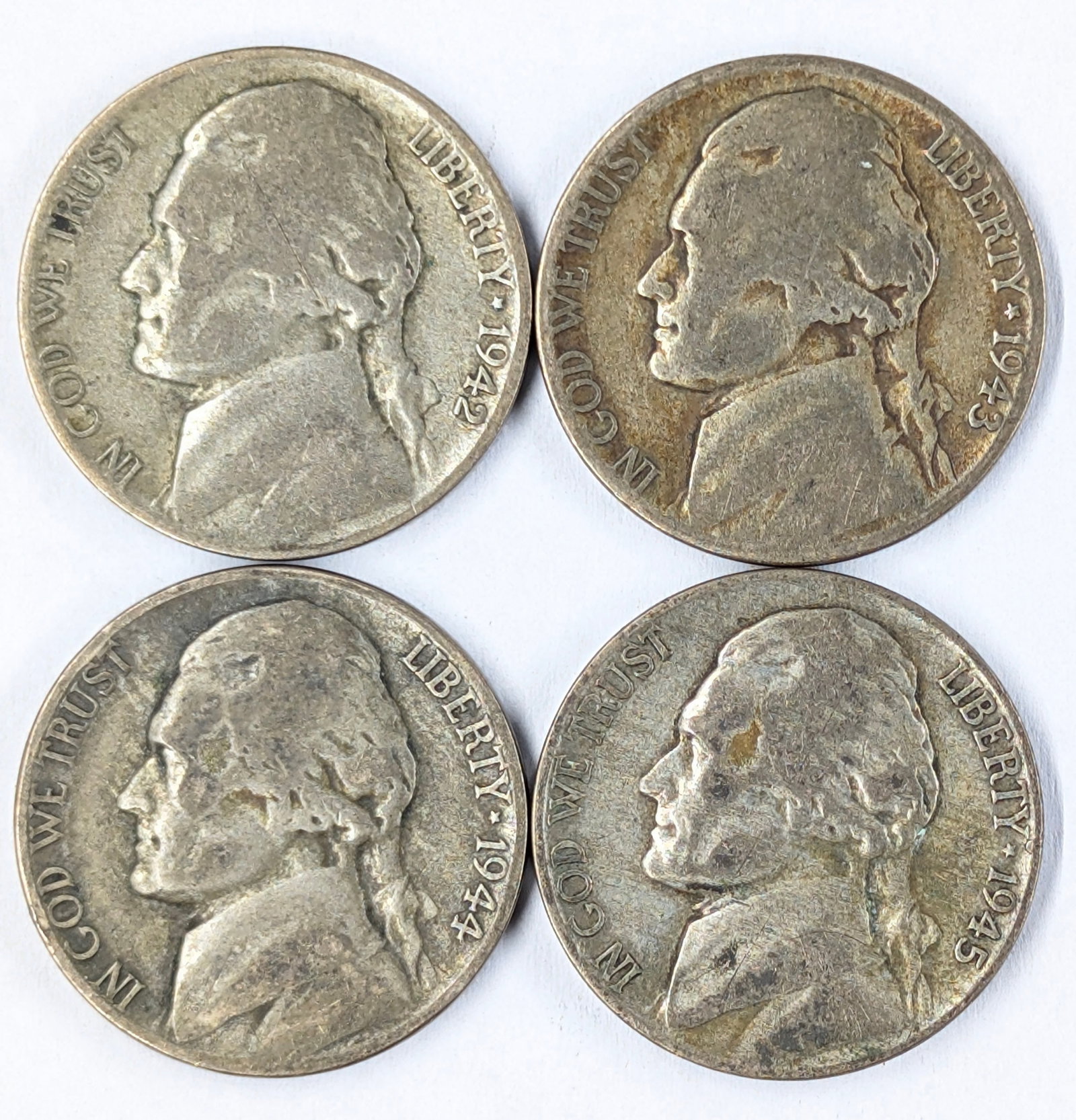 Lot of 4 Silver War Nickels 1942-1945: _
