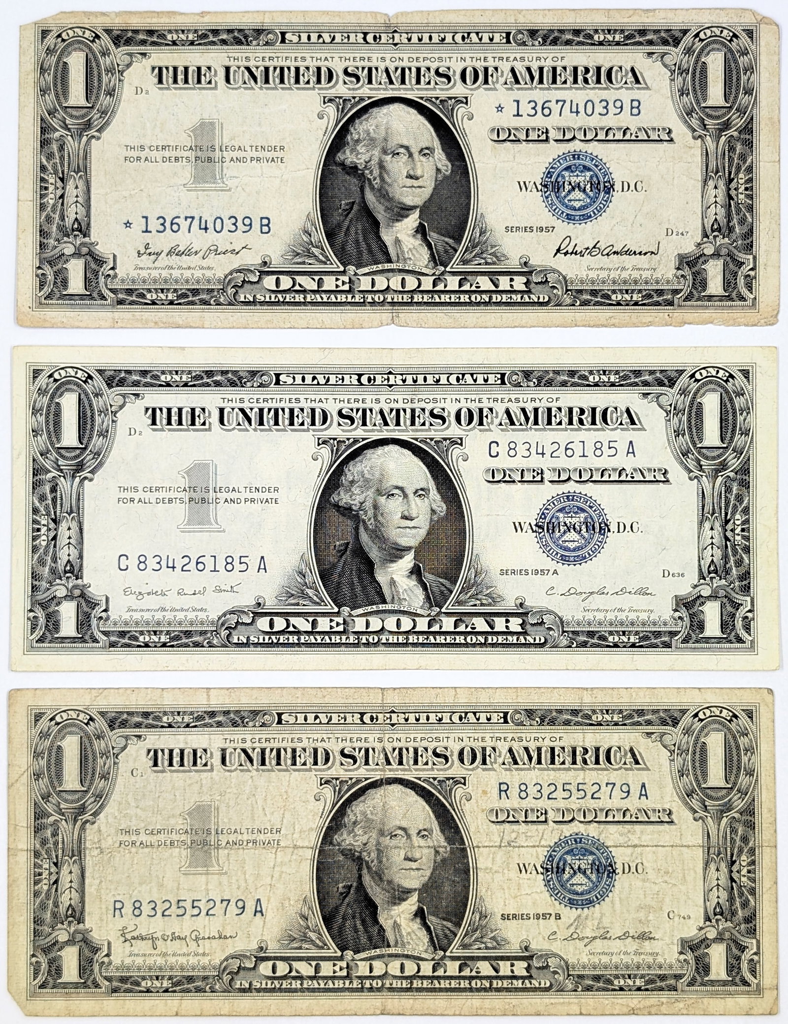 Lot of 3, 1957 $1 Notes - Silver Certificates including Star Note: Circulated Condition