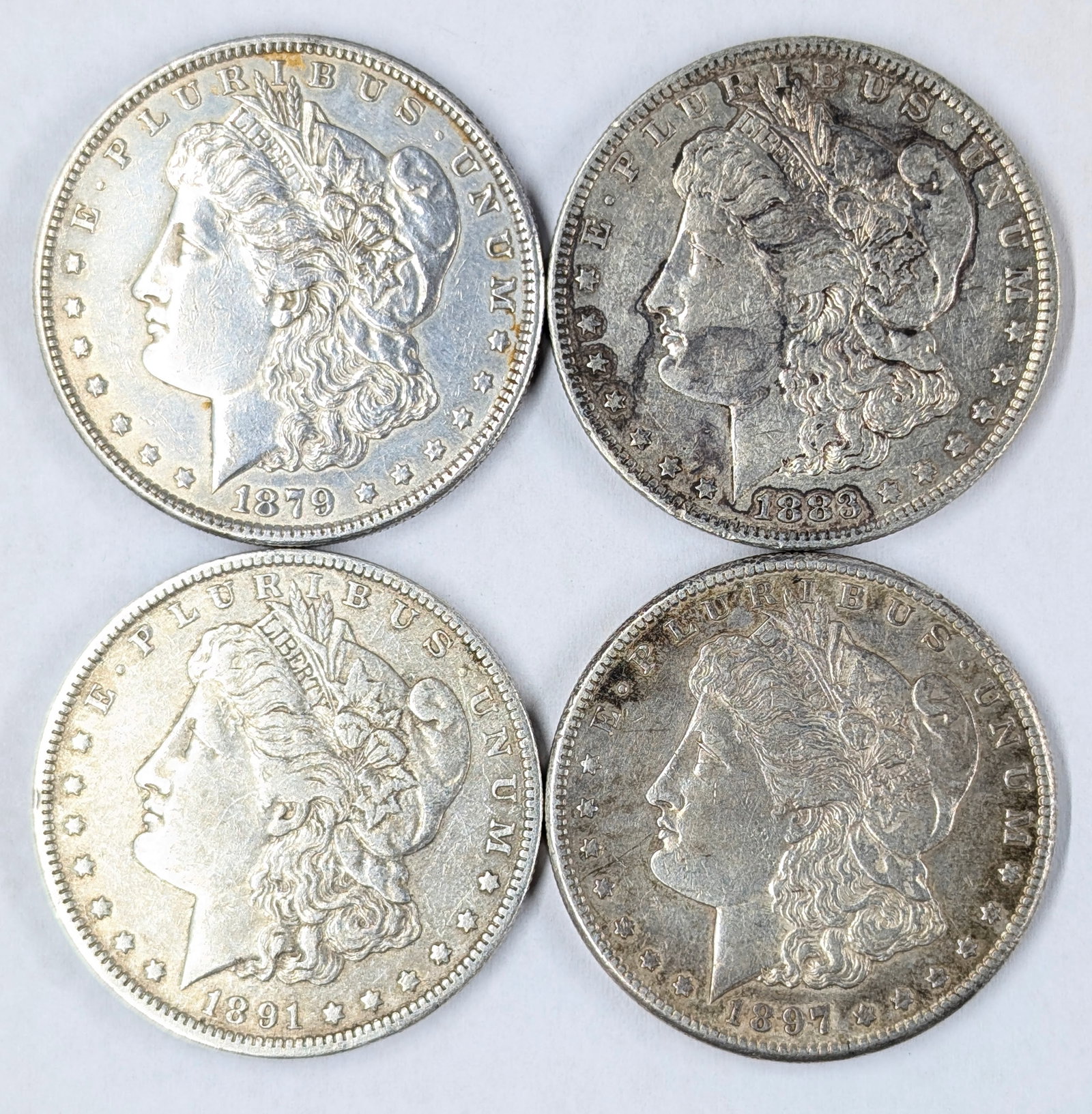 Lot of 4 Morgan Silver Dollars - 1879-S, 1883-O, 1891-O & 1897-S: _