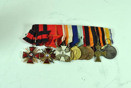 Group of 9 Russian Imperial Orders & Medals: Group of 9 Russian Imperial orders & medals (from R to L): 1. Japanese silver red cross medal // 2. gilt bronze St. George 1st Class cross #35/680 // 3. bronze medal to commemorate the 300th anniversa