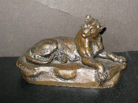 BRONZE RECLINING LIONELL SIGNED L CARVIN