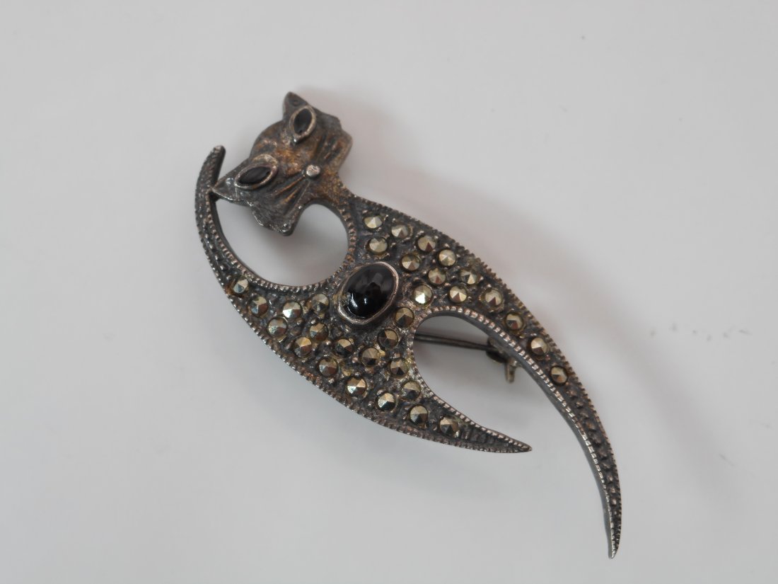Onyx and Marcasite Sterling Silver Cat Pin, Art Deco shape, Stamped 925: About 1-3/4 inches long Bidding on this item is acceptance of our posted Auction Policy