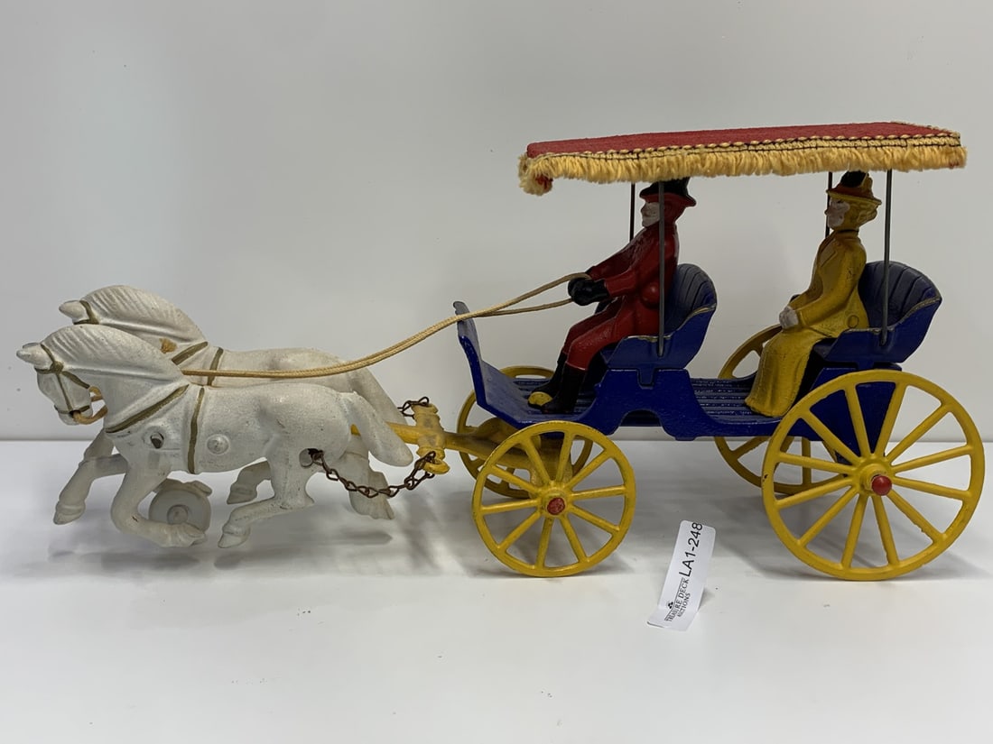 Vintage Cast Iron Horse & Buggy Miniature, Hand Painted, Driver & Lady Passenger, Fabric Fringe Top: measures 14 inches assembled (parts detach) Bidding on this item is acceptance of our posted Auction Policy