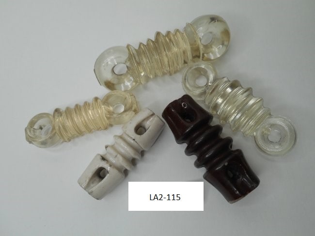 Small Collection of Vintage Glass and Porcelain Ribbed Electric Insulators, 5 pieces, minor chips: Bidding on this item will be indication that the Bidder acknowledges that they have read and agreed to the Terms and Conditions posted to this Auction