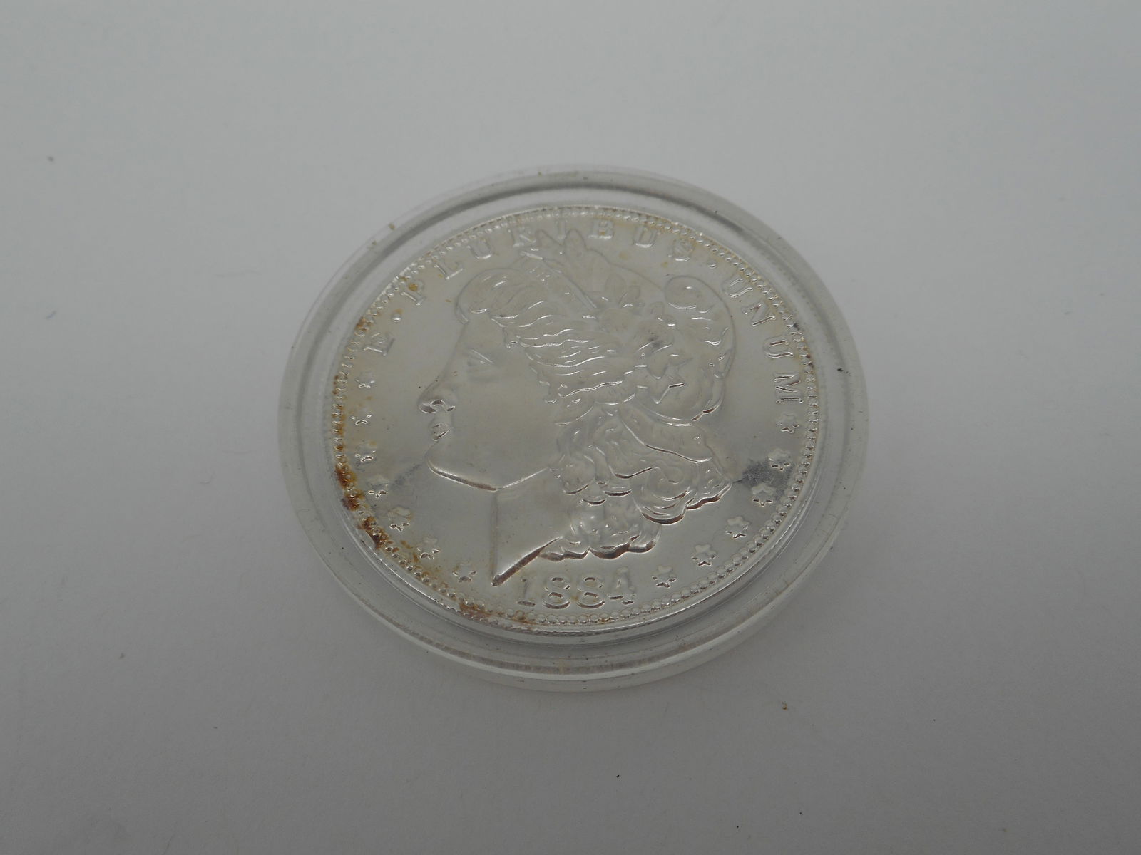 1884 Commemorative Silver Dollar Coin - COPY - E Pluribus Unum, 1.5 inches, with hard plastic case: Bidding on this item will be indication that the Bidder acknowledges that they have read and agreed to the Terms and Conditions posted to this Auction