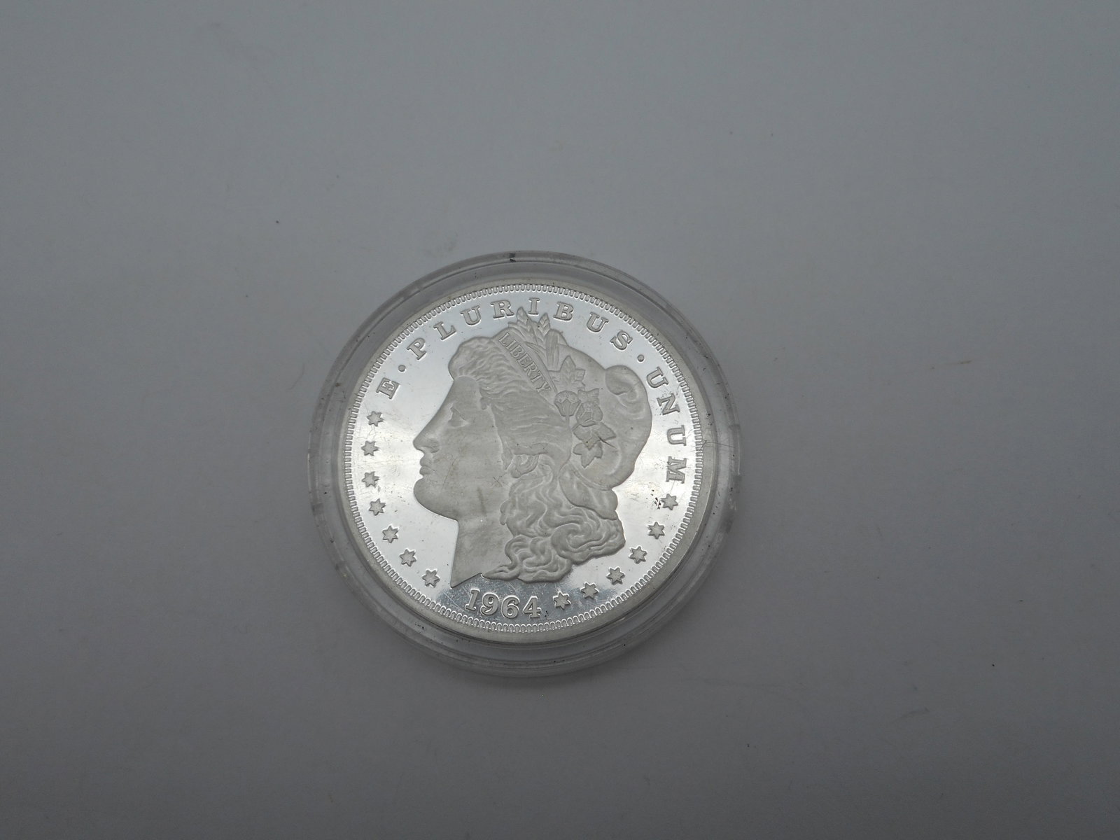 2021 Commemorative 1964 Silver Dollar,Cook Islands, Tribute to the US, 1.5 inches, hard plastic case: Bidding on this item will be indication that the Bidder acknowledges that they have read and agreed to the Terms and Conditions posted to this Auction