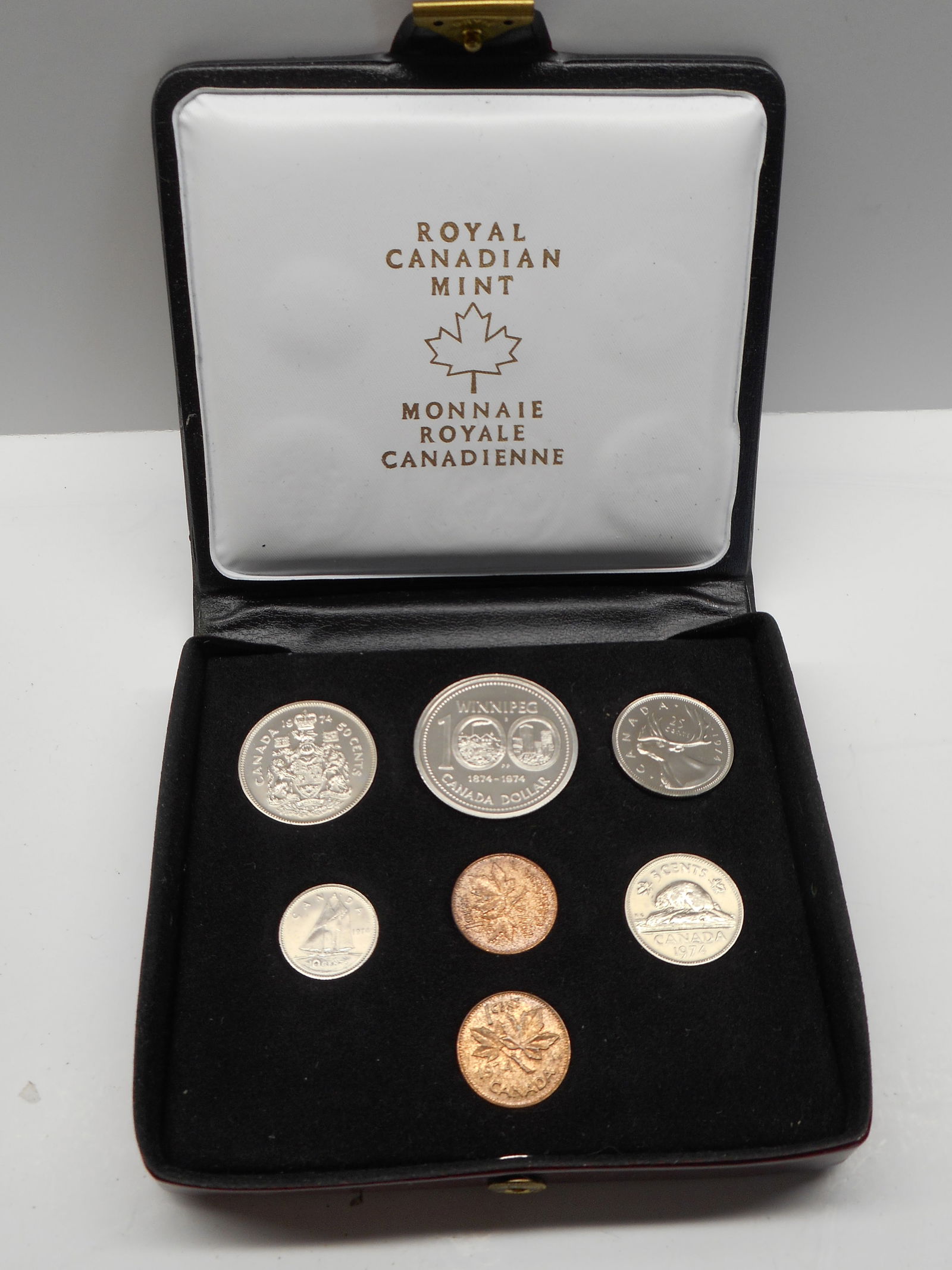 1974 Royal Canadian Mint Seven Coin Set in Vinyl Case with Snap Closure: Bidding on this item will be indication that the Bidder acknowledges that they have read and agreed to the Terms and Conditions posted to this Auction