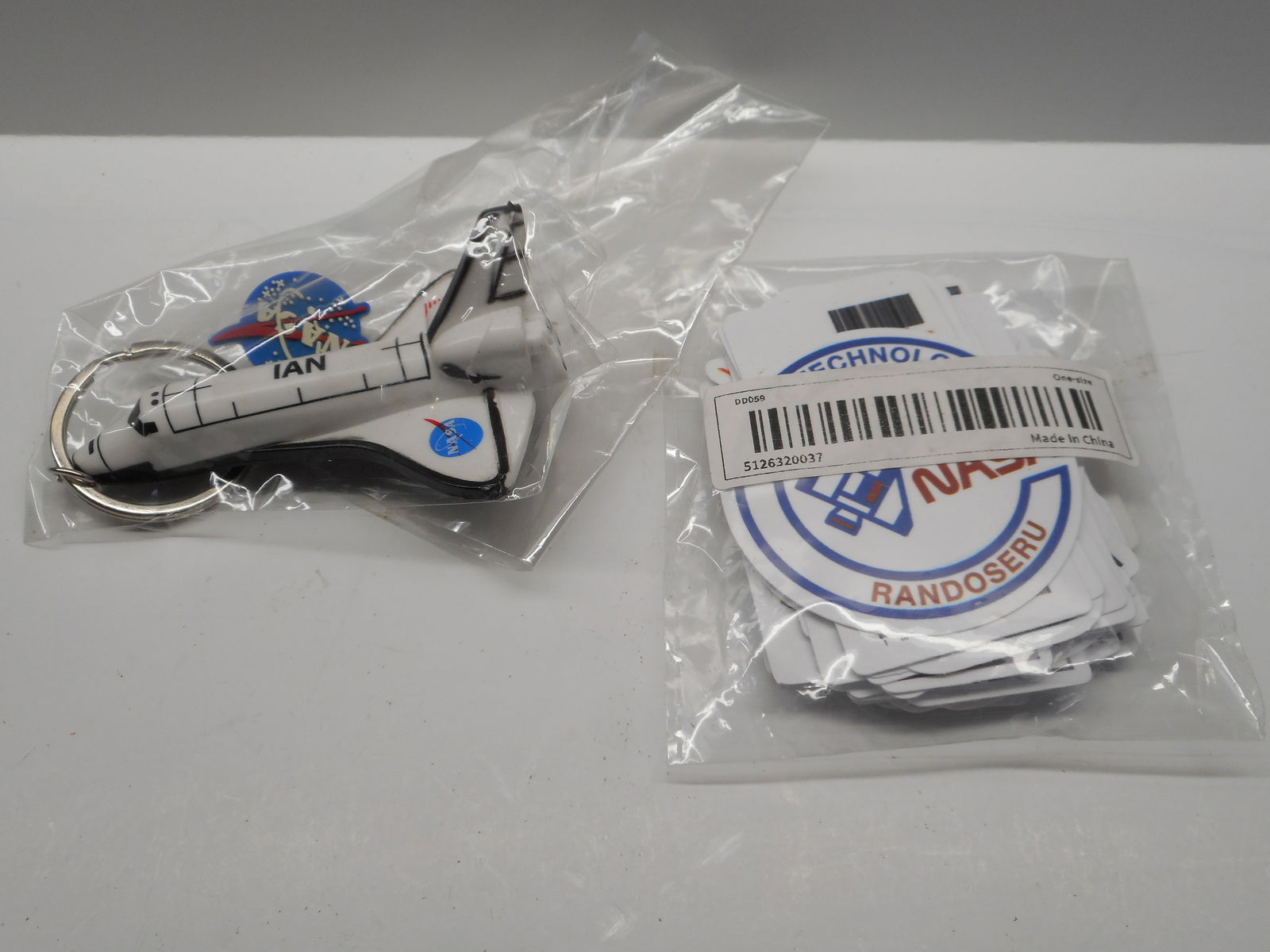 NASA Discovery Shuttle Personalized Keychain, name IAN, Kennedy Space Center & NASA Stickers, NIP: packages not opened for photos Bidding on this item will be indication that the Bidder acknowledges that they have read and agreed to the Terms and Conditions posted to this Auction