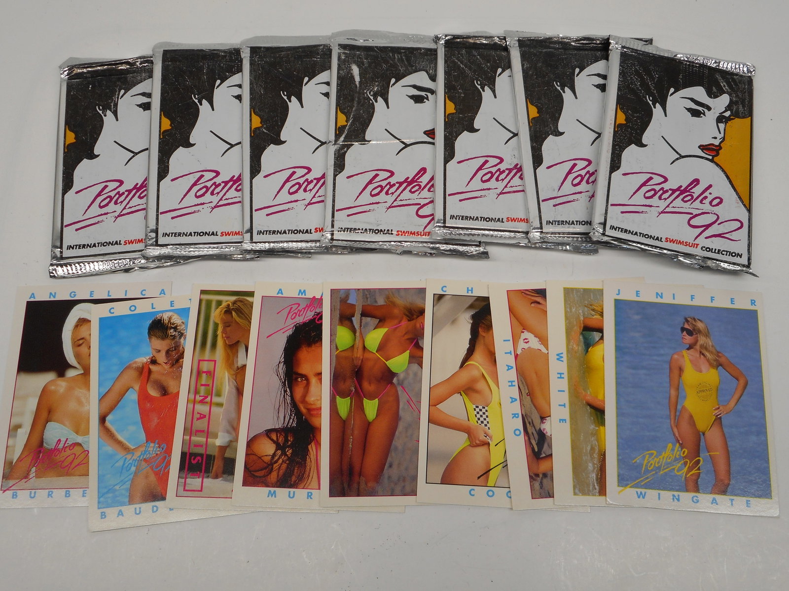 7 Sealed Packs of Portfolio 92 International Swimsuit Collection, Model Trading Cards, Some Loose: Bidding on this item will be indication that the Bidder acknowledges that they have read and agreed to the Terms and Conditions posted to this Auction