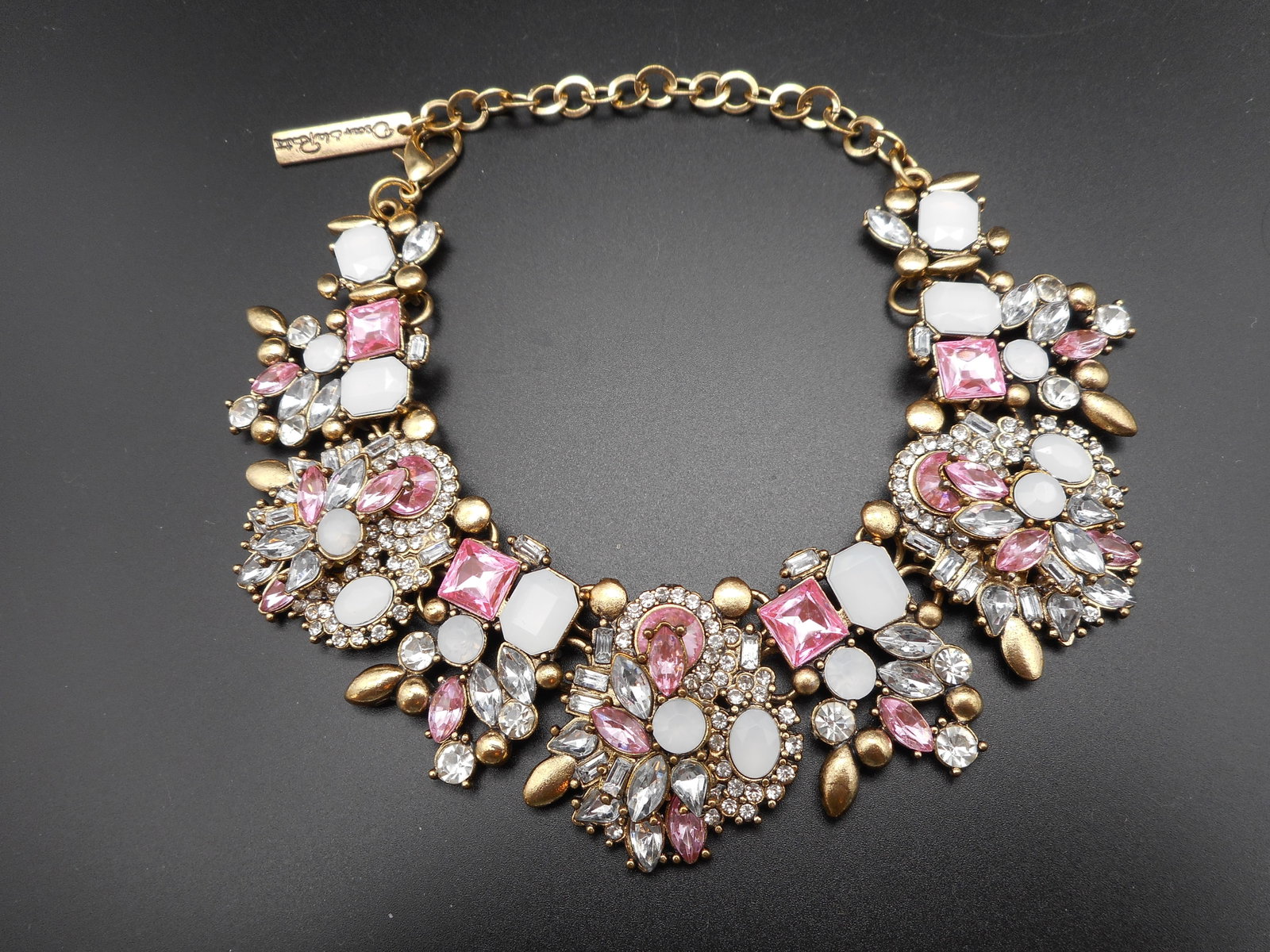 Pink, White & Silver Chunky Rhinestone Collar Necklace, Tag Says Oscar De La Renta, Made in USA: 11 inches clasp to end of chain Bidding on this item will be indication that the Bidder acknowledges that they have read and agreed to the Terms and Conditions posted to this Auction