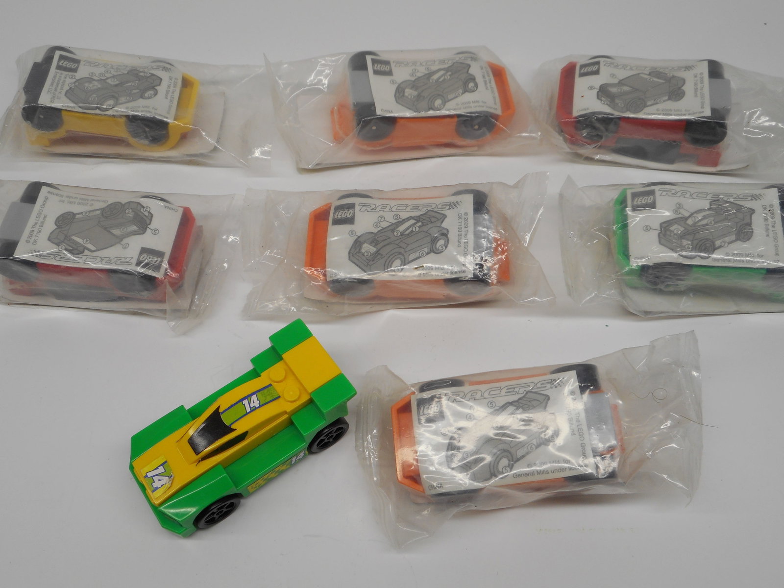 LEGO Racers Toy Cars, Prizes from General Mills Cereal - 1 opened, used and 7 new in packages: Bidding on this item will be indication that the Bidder acknowledges that they have read and agreed to the Terms and Conditions posted to this Auction