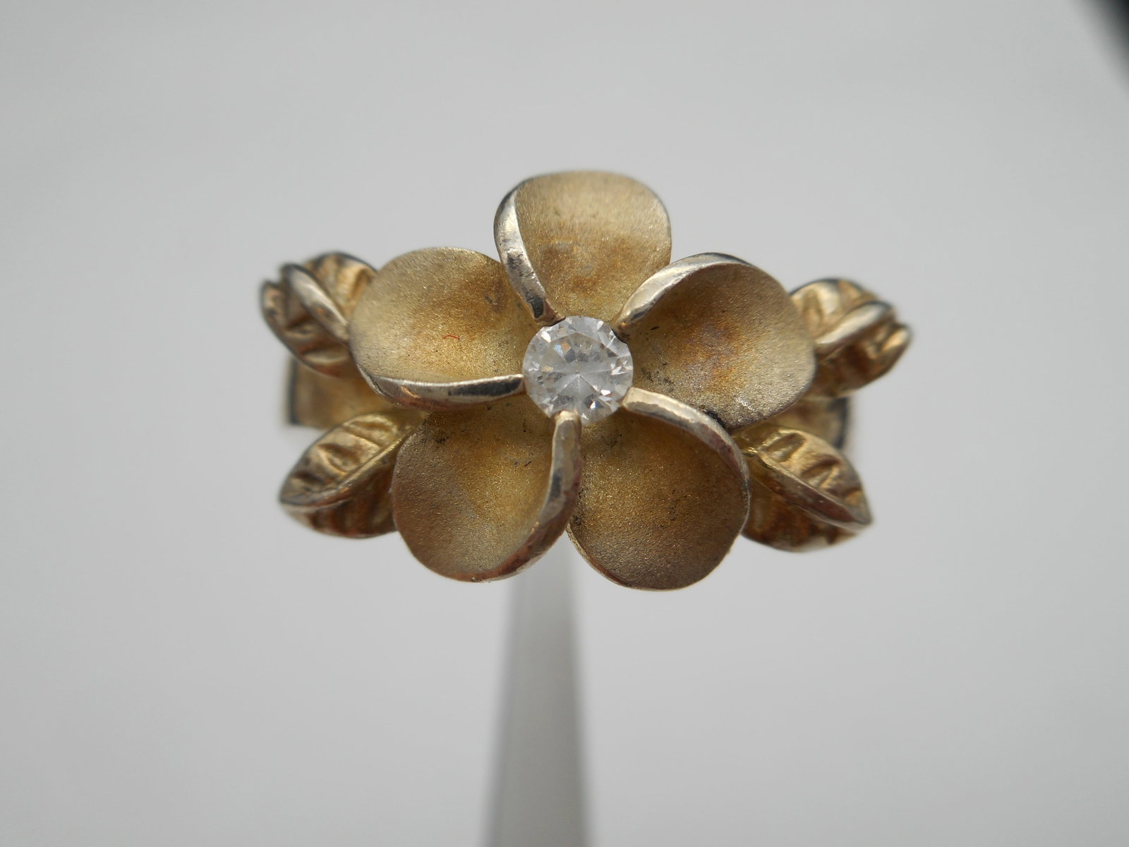 Sterling Silver Ring, Hawaiian Style Plumeria Flower With CZ Center, 4 Leaves, Stamped 925, Size 7: Bidding on this item will be indication that the Bidder acknowledges that they have read and agreed to the Terms and Conditions posted to this Auction