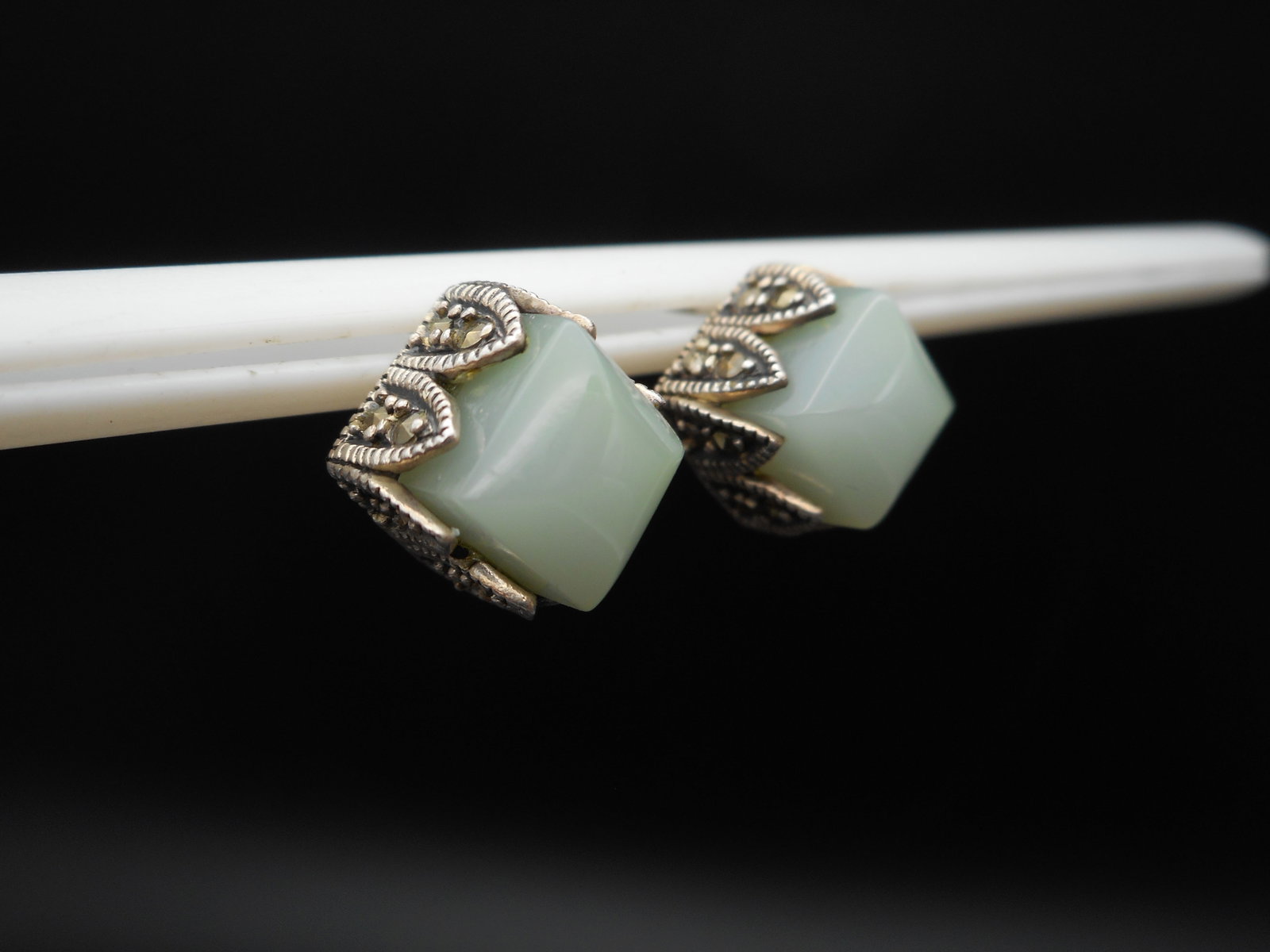 Polished Mint Green Stone Earrings in Sterling Silver Marcasite Stud Settings, 1 cm, Marked 925 MO: Postbacks are clear plastic, not photographed Bidding on this item will be indication that the Bidder acknowledges that they have read and agreed to the Terms and Conditions posted to this Auction