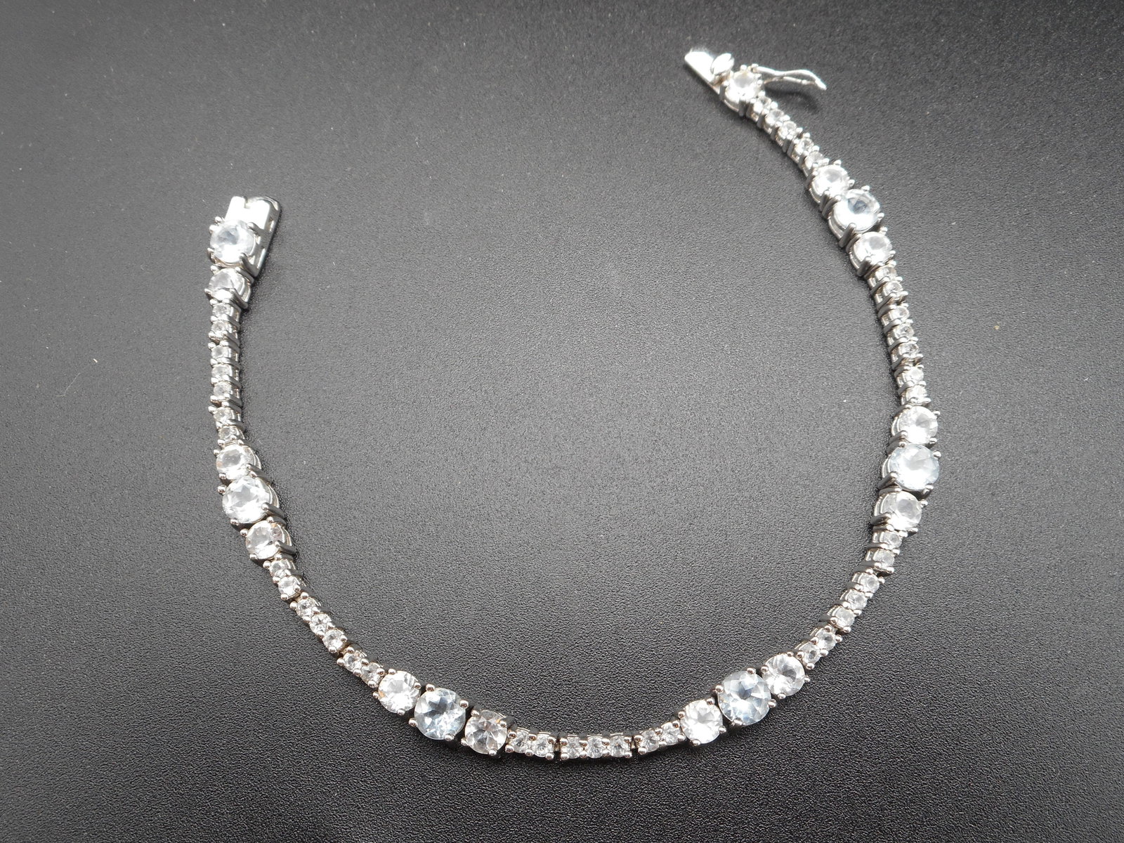 Sparkling Tennis Bracelet, Light Blue and Clear Stones, Sterling Silver, 925, 7.5 inches: Bidding on this item will be indication that the Bidder acknowledges that they have read and agreed to the Terms and Conditions posted to this Auction