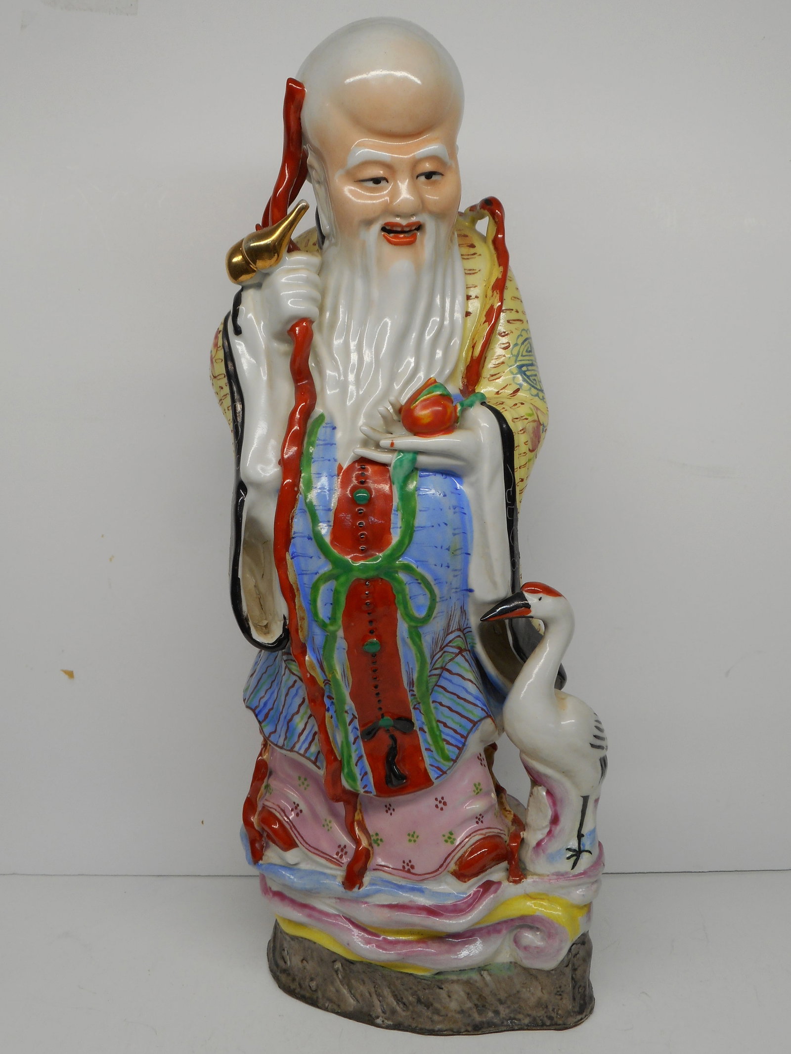 Exceptional Hand Painted Chinese Porcelain Statue of a Shou Xing Figure with Crane, 14 inches: small chip in base, easy to color/fill, also hold in bottom of lining Bidding on this item will be indication that the Bidder acknowledges that they have read and agreed to the Terms and Conditions po
