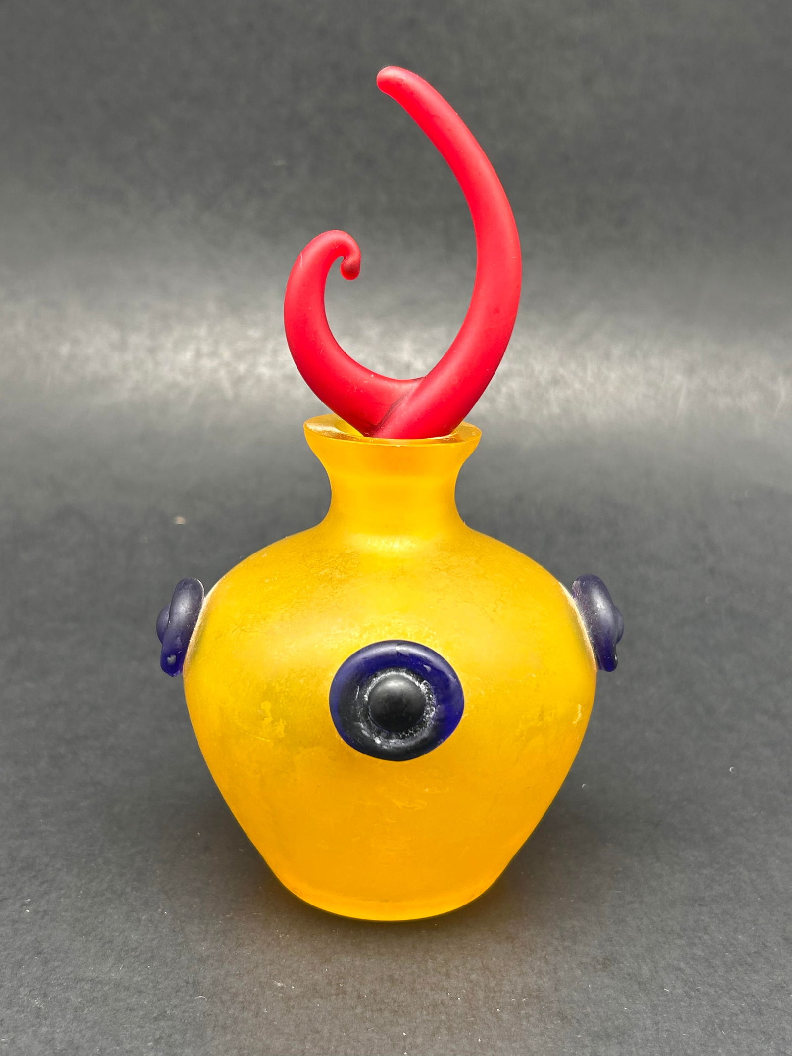 Postmodern Yellow Frosted Glass Perfume Bottle with Red Swirled Stopper, 6" tall, Glows in UV Light (1 of 5)