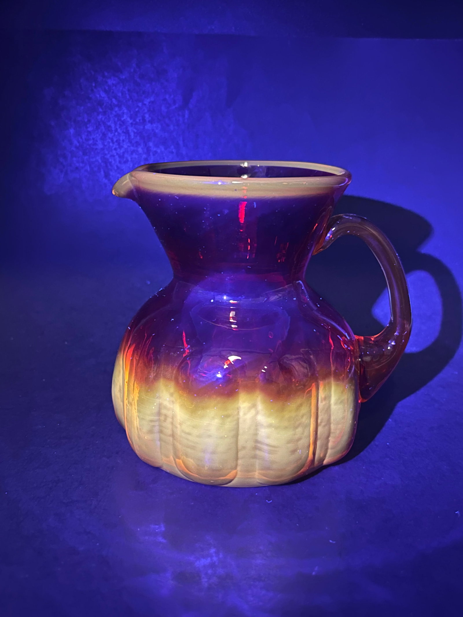 Amberina Red and Orange Glass Pitcher, Vintage, Glow under UV Light, Some Small Bubbles, 4.5" tall: Bidding on this item will be indication that the Bidder acknowledges that they have read and agreed to the Terms and Conditions posted to this Auction