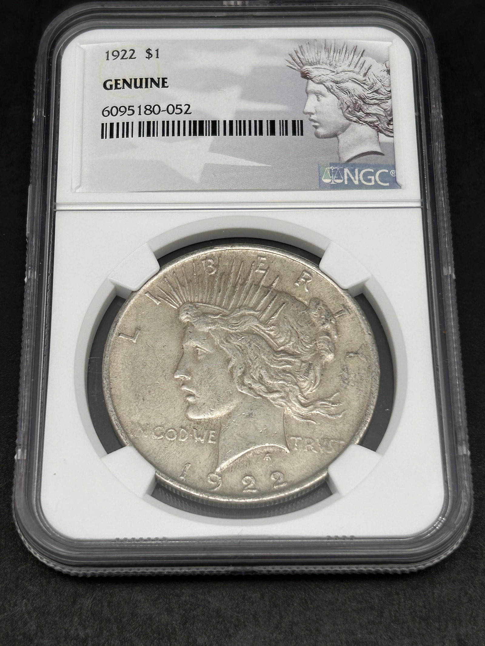 1922 Genuine Peace Dollar, NGC Authenticated, $1, Liberty: Bidding on this item will be indication that the Bidder acknowledges that they have read and agreed to the Terms and Conditions posted to this Auction