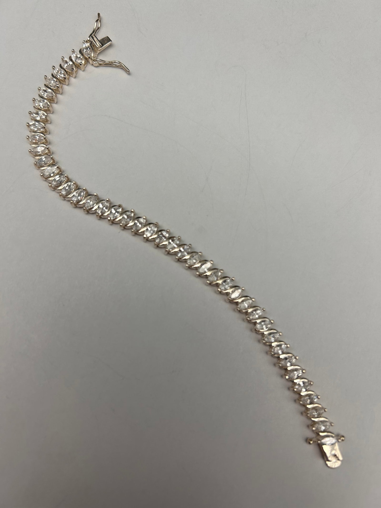 Marquise Cut Stone Tennis Bracelet by Prime Art and Jewels, Marked 925, 6": Bidding on this item will be indication that the Bidder acknowledges that they have read and agreed to the Terms and Conditions posted to this Auction