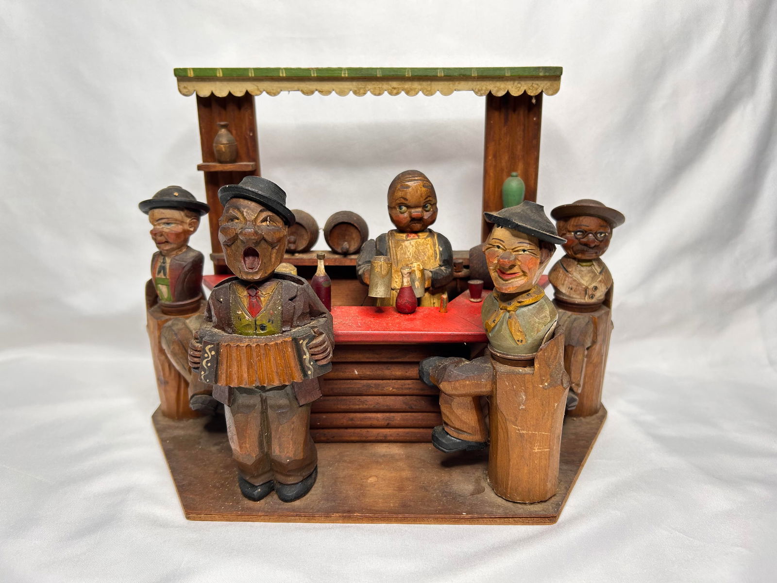 Carved Antique Bar Scene Wind Up Music Box with Wine Stoppers, Corkscrew & Bottle Opener, 12 x 9": not working Bidding on this item will be indication that the Bidder acknowledges that they have read and agreed to the Terms and Conditions posted to this Auction