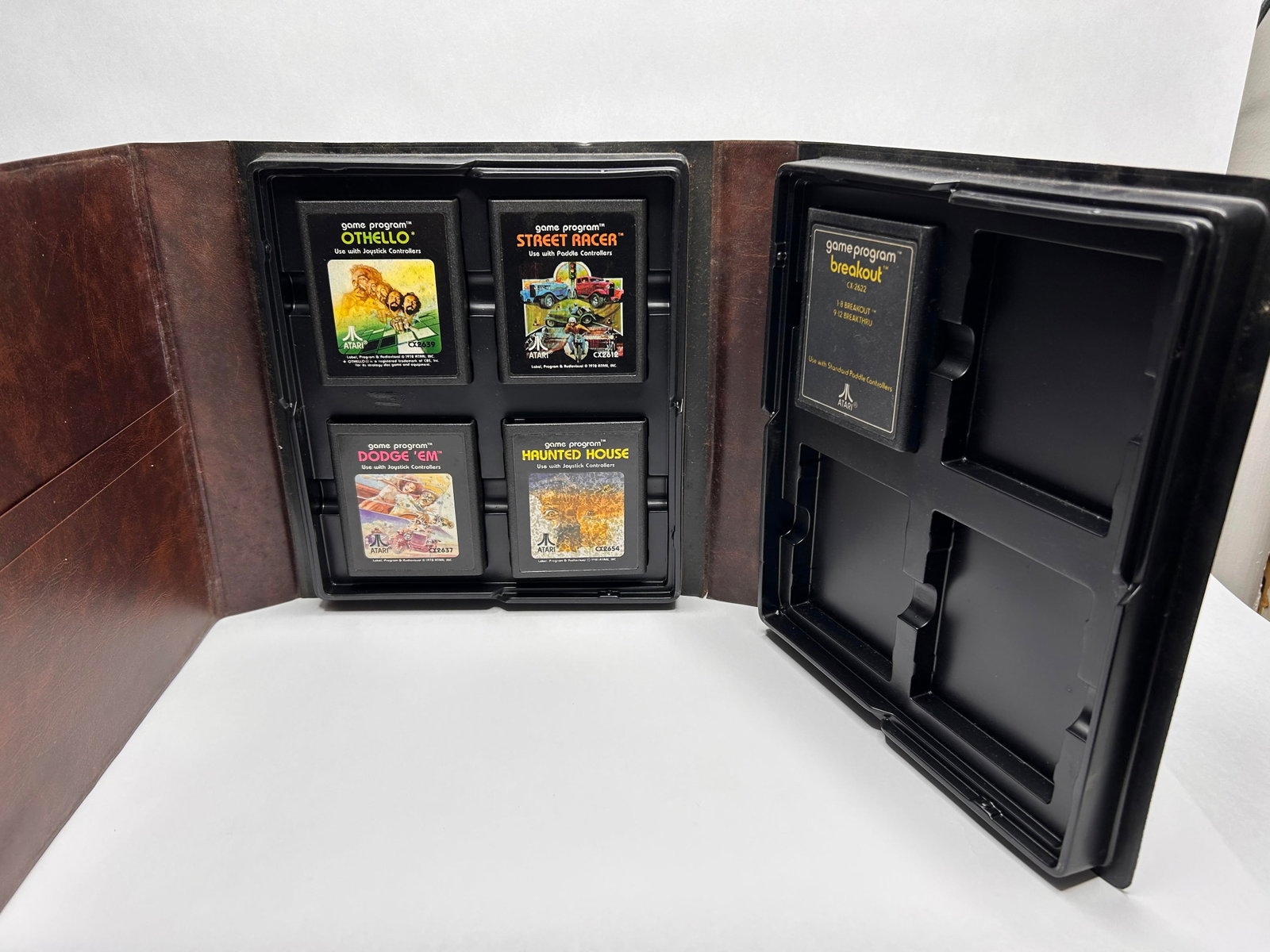 ATARI Game Case with Game Cartridges, 1970s - 1980s, Incl. Street Racer, Othello, & Breakout: Bidding on this item will be indication that the Bidder acknowledges that they have read and agreed to the Terms and Conditions posted to this Auction