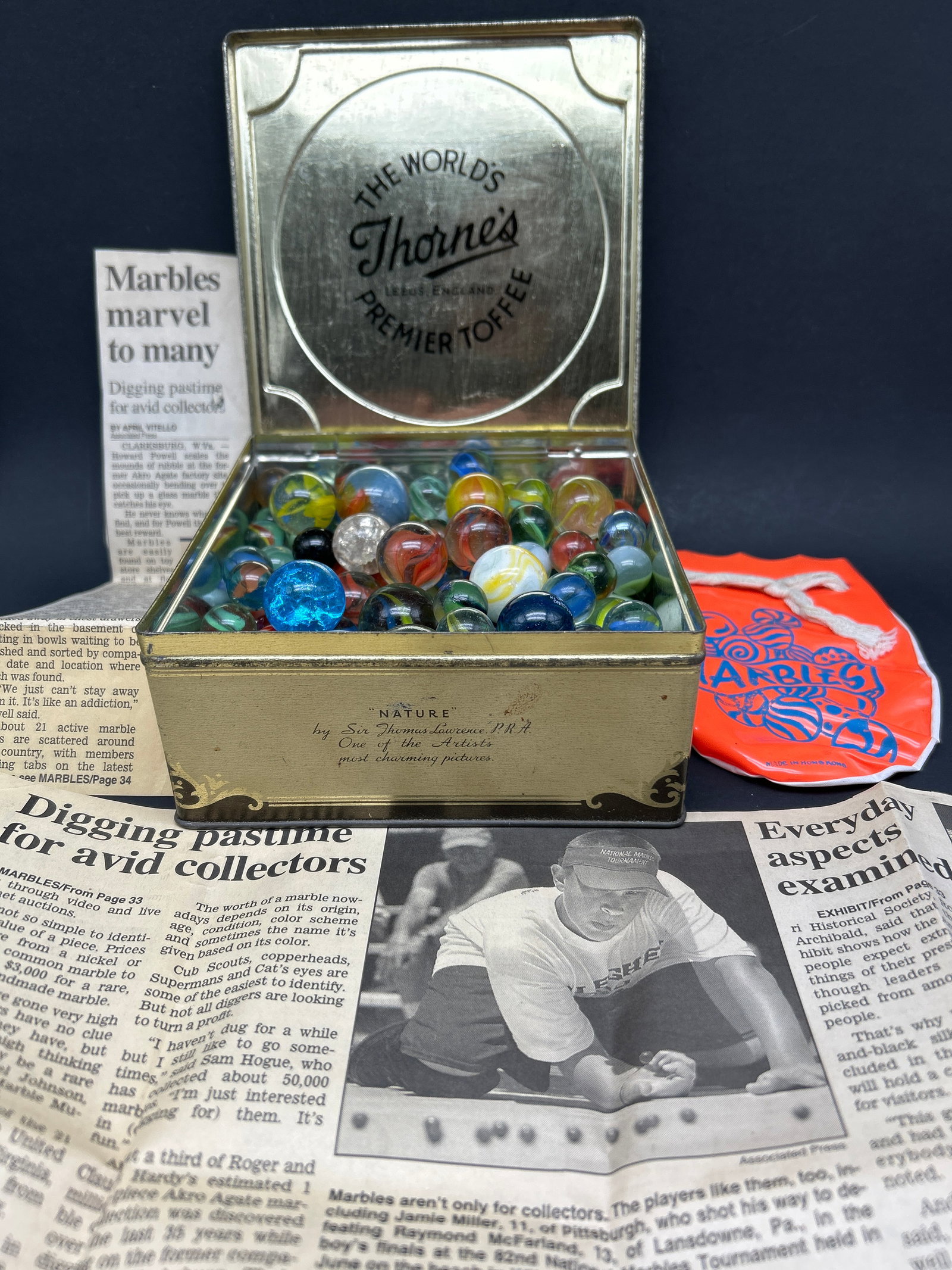 Vintage Marbles & Vinyl Marbles Pouch, Newspaper Clipping, Stored inThorne's Coffee 5.5" x 5.5" Tin: Bidding on this item will be indication that the Bidder acknowledges that they have read and agreed to the Terms and Conditions posted to this Auction