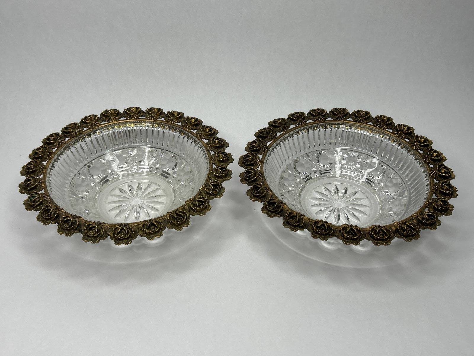 Pair of Cut Glass Vanity Bowls / Dishes with Brass Rose Border, 7" Diameter: Bidding on this item will be indication that the Bidder acknowledges that they have read and agreed to the Terms and Conditions posted to this Auction