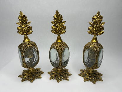 Set of (3) STYLEBUILT NY Gold Ormolu Filigree and Glass Perfume Bottles, 8.5" tall: Dimensions provided are per bottle Bidding on this item will be indication that the Bidder acknowledges that they have read and agreed to the Terms and Conditions posted to this Auction