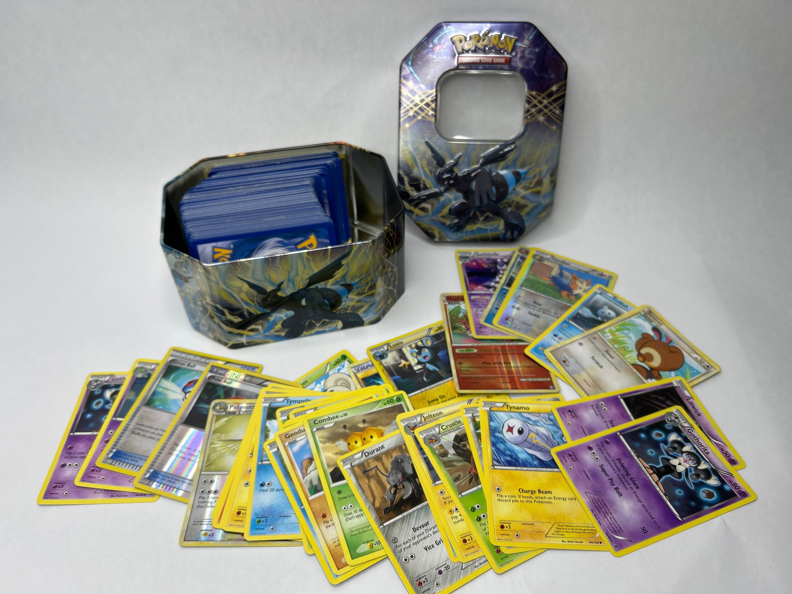 POKEMON TCG 3" Stack of Assorted Cards in EX Tin: Bidding on this item will be indication that the Bidder acknowledges that they have read and agreed to the Terms and Conditions posted to this Auction