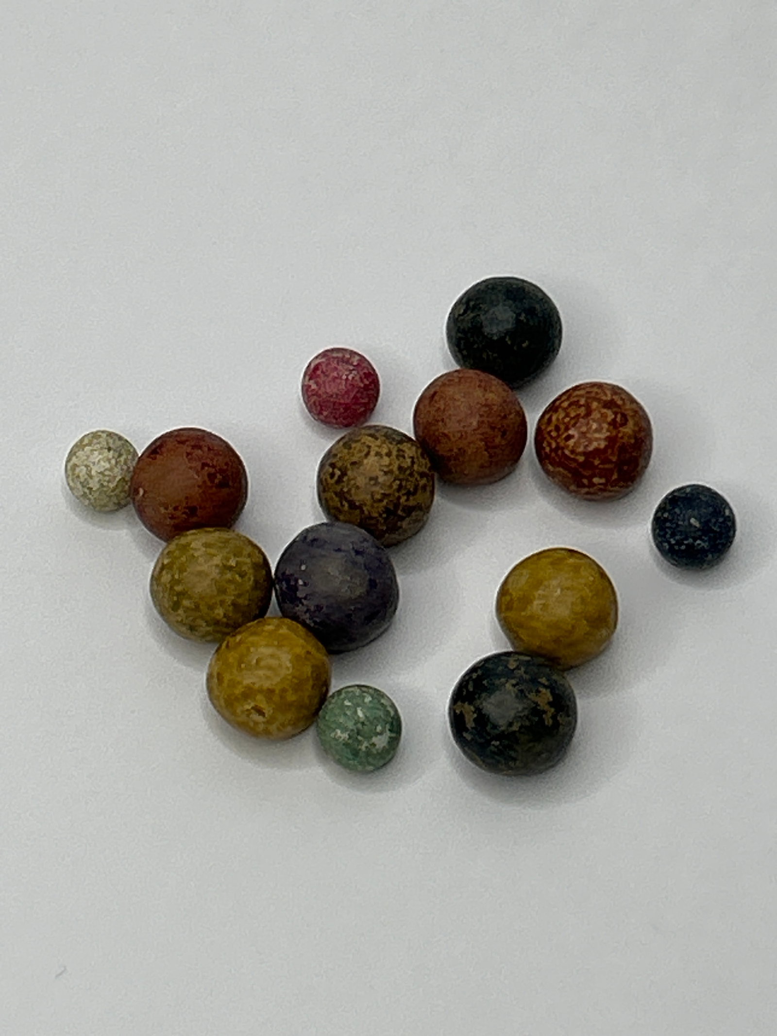 Lot of Antique Paint/Glaze Clay Marbles, 3/8" to 1/2" Diameter: Bidding on this item will be indication that the Bidder acknowledges that they have read and agreed to the Terms and Conditions posted to this Auction
