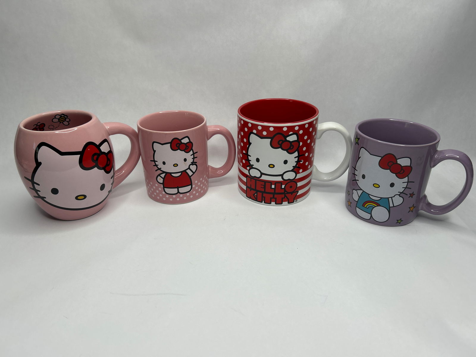 Fun Collection of Four HELLO KITTY Mugs, Different Colors and Styles/Designs, Sanrio, Unused: **Bidding on this lot is acceptance of Terms & Conditions found in the Auction Details section at the top of our Auction. Bidder agrees all questions should be submitted prior to placing a bid.**