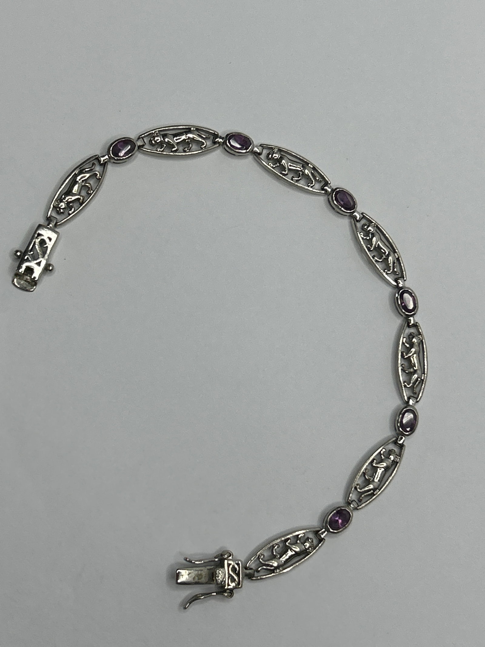 DEE BERKLEY Sterling Silver Amethyst and Panther Link Bracelet, Marked 925 ITALY DBJ: **Bidding on this lot is acceptance of Terms & Conditions found in the Auction Details section at the top of our Auction. Bidder agrees all questions should be submitted prior to placing a bid.**