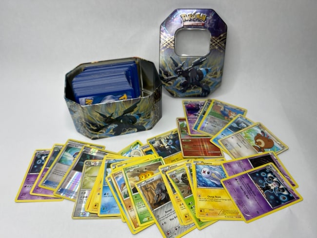 POKEMON TCG 3" Stack of Assorted Cards in Pokemon EX Tin: **Bidding on this lot is acceptance of Terms & Conditions found in the Auction Details section at the top of our Auction. Bidder agrees all questions should be submitted prior to placing a bid.**