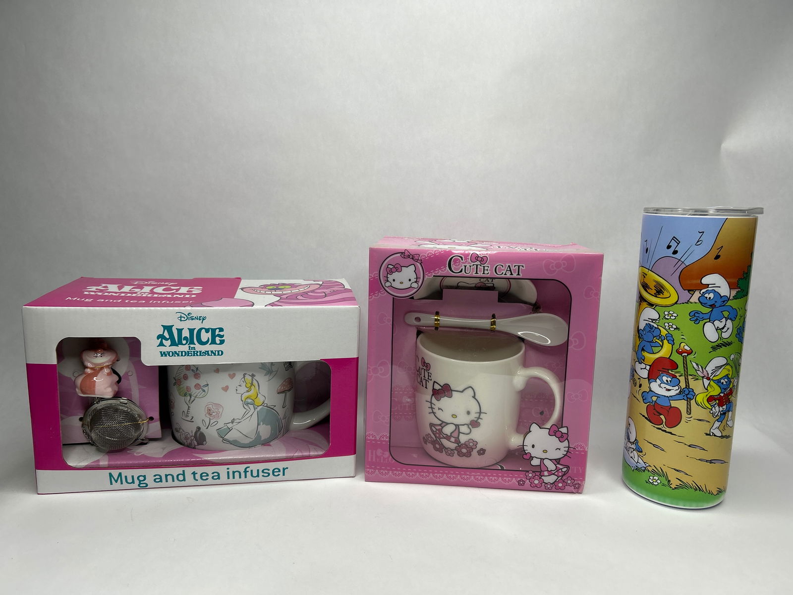 Smurfs Thermos, Hello Kitty Hot Chocolate Mug set and Alice in Wonderland Mug & Tea Diffuser: **Bidding on this lot is acceptance of Terms & Conditions found in the Auction Details section at the top of our Auction. Bidder agrees all questions should be submitted prior to placing a bid.**