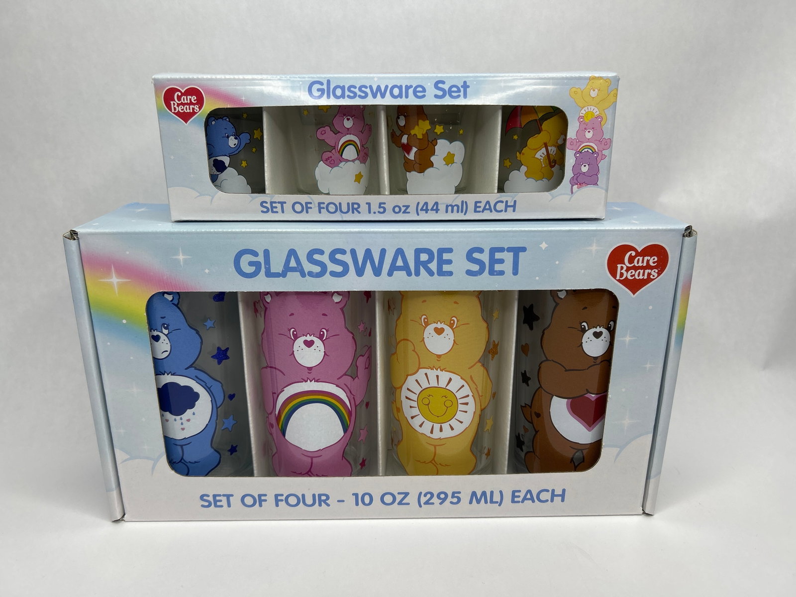 Two New in Package 4-Set CAREBEAR Glassware, 4 x 10oz Juice Glasses and 4 x 1.5 oz Shot Glasses: **Bidding on this lot is acceptance of Terms & Conditions found in the Auction Details section at the top of our Auction. Bidder agrees all questions should be submitted prior to placing a bid.**