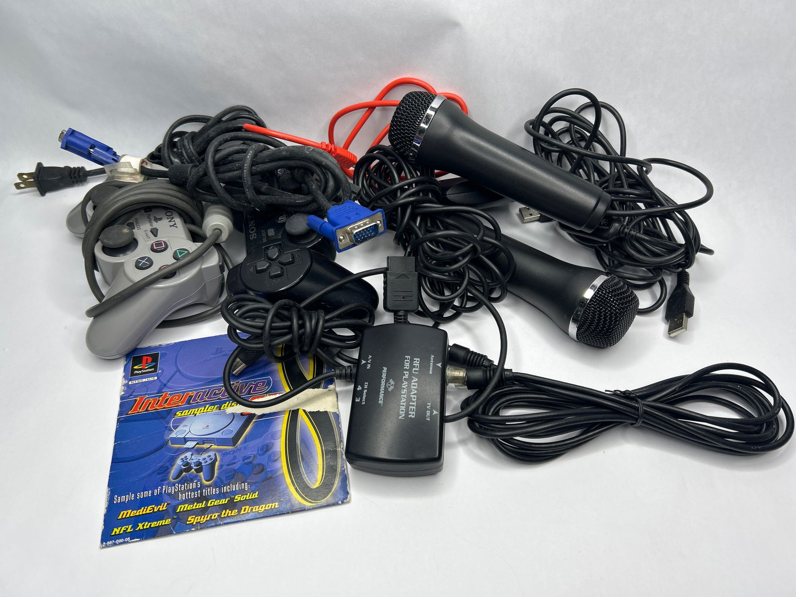 Miscellaneous SONY Playstation Accessories - Microphones, Controllers, Cords, All Parts Shown: **Bidding on this lot is acceptance of Terms & Conditions found in the Auction Details section at the top of our Auction. Bidder agrees all questions should be submitted prior to placing a bid.**