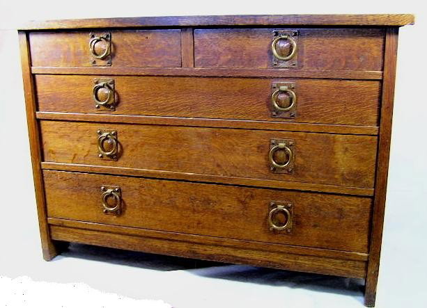 GUSTAV STICKLEY Low Chest of Drawers: Original Red Decal in Drawer indicating 1905-1912 - Low Chest - Two-Over-Three Drawer Configuration - Hand Hammered Copper Ring Pull Hardware - What appears to be the original finish - Measures 33"H X