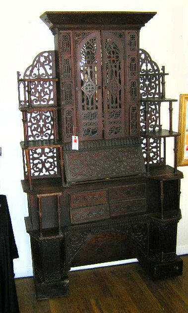 AMERICAN 19C. TRAMP ART CABINET - GOTHIC: MADE WITH VARIOUS WOODS AND CIGAR BOX DOOR - MEASURES 79"TX46"WX17"D OVERALL