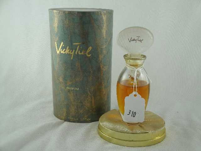 VICKY TIEL - HALF FULL BOTTLE IN BOX - FIGURAL DAU: BOTTLE MEASURES 5.5" TALL