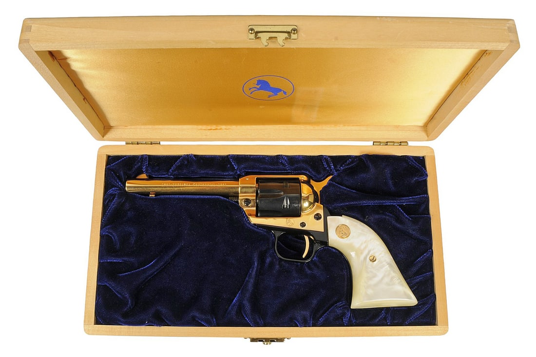 Colt Firearms Commemorative Nebraska Centenniall 22 LR Frontier Scout Revolver - FFL#126211EB (J2D1): A cased gold-plated Colt Firearms Commemorative Nebraska Centennial 22 LR Frontier Scout SA Revolver in very good condition with a bright and defined bore. The action appears to function properly with