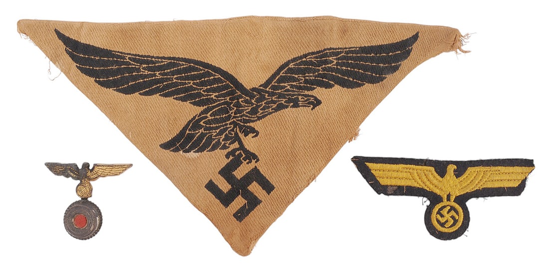 *German Military WWII era Nazi Insignia (H3S): A group lot of German Military WWII era Nazi Insignia included a Luftwaffe athletic shirt insignia, A Political Hat pin insignia and a Kriegsmarine breast eagle on fair to good condition. *Due to Prox