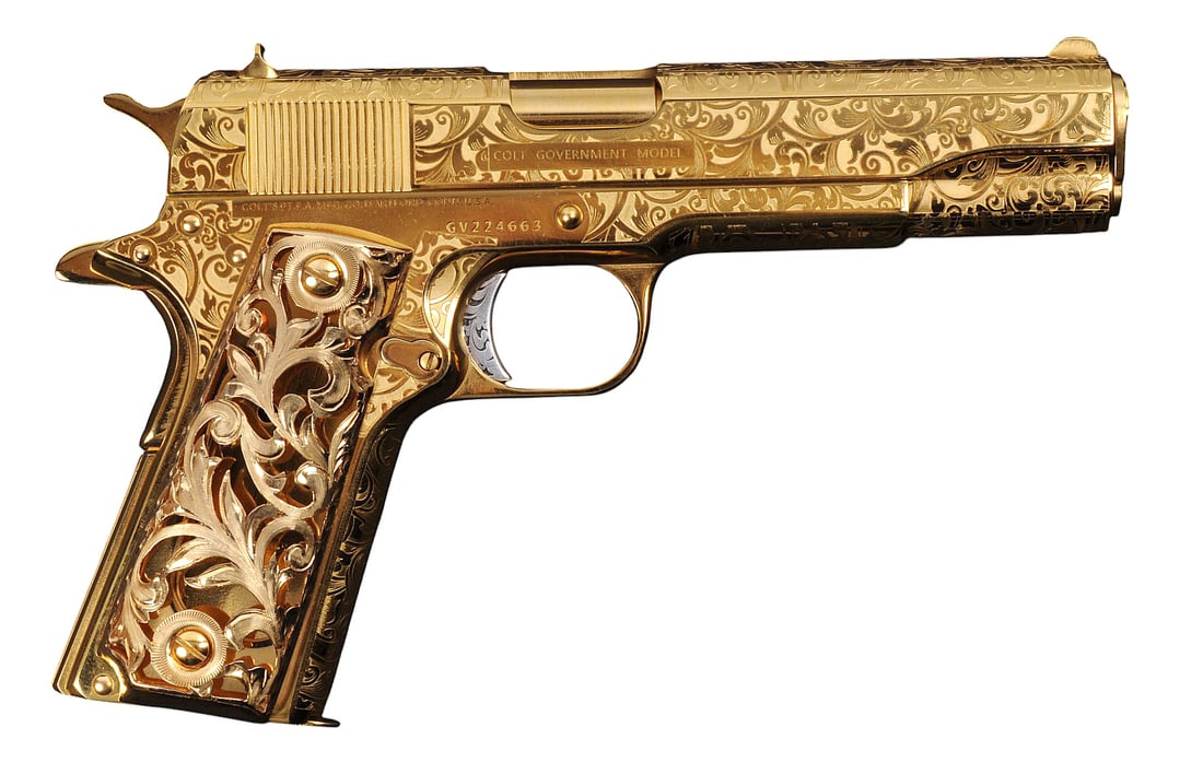 Colt MKIV 70 Series 24 KT. Gold Plated Custom Engraved 45 ACP Semi-Auto Pistol FFL # GV224663(M2A1): A Colt M1911 Government Model MKIV 70 Series Mod 0 24 K. Gold Plated and Custom Engraved 45 ACP Semi-Auto Pistol with 24K Solid Gold Grips and 24 K Gold Magazine in very good condition with a bright a